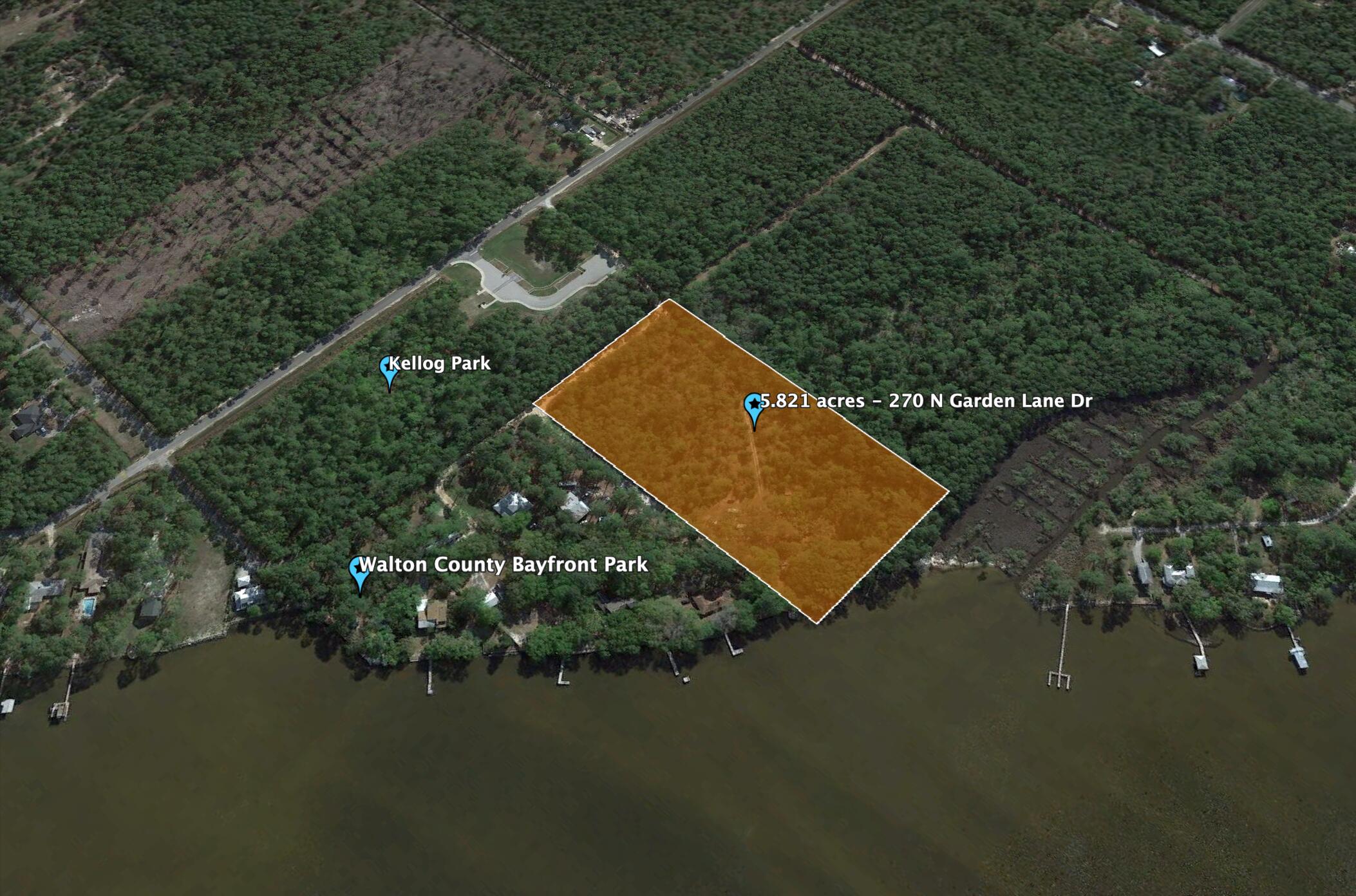 This  is a rare opportunity to own a 5+ acre property that kisses the bay in the north east corner. Majestic Oaks, Pines and Southern Magnolias dot the property throughout. Property could be used for one estate size spectacular homesite overlooking the water, or work with the county to further develop.  Underground power is at the property. To the south of this property is the Kellogg Nature Center with parking and trail to the Kellogg Bay front Park. To see the property in person, 24 hour advanced notice required to view the property. Owners live at the property. Call your agent to schedule a time to see the property in person. NO DRIVE BYs.