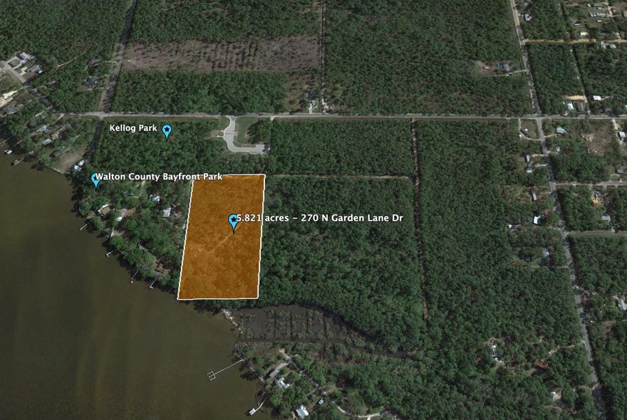 This  is a rare opportunity to own a 6.68 acre property that kisses the bay. Maps indicate about 130ft of waterfront. Oaks, Pines and Southern Magnolias dot the property throughout. Current zoning is Neighborhood Infill, up to 8 units per acre . Property could be used for one large estate size spectacular homesite overlooking the water, or work with the county to further develop.  Underground power is at the property. To the south of this property is the Kellogg Nature Center with parking and trail to the Kellogg Bay front Park. Coming soon is a new discovery building.To see the property in person, 24 hour advanced notice required to view the property. Owners live at the property. Call your agent to schedule a time to see the property in person. NO DRIVE BY