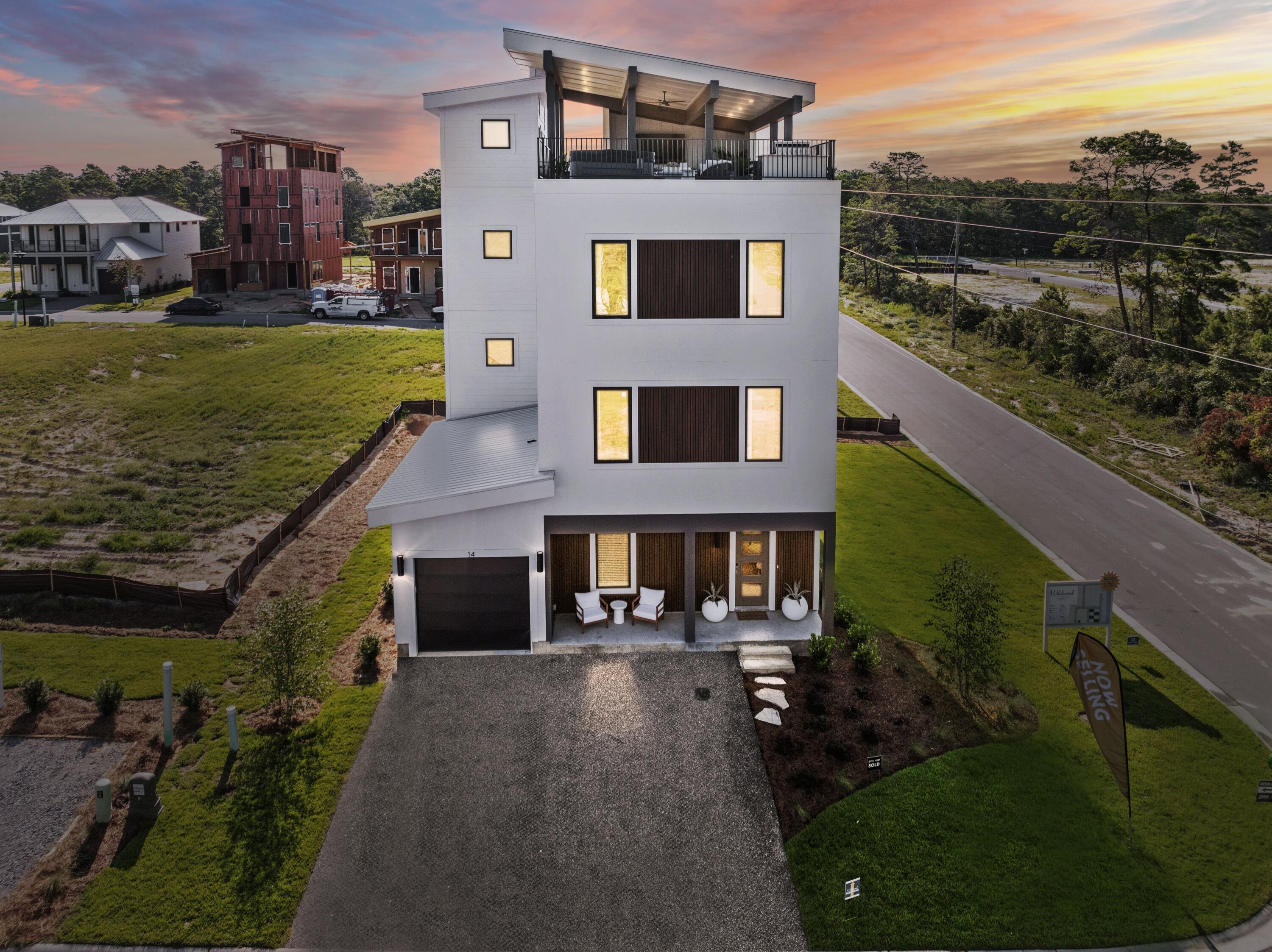 *Ask us about our rates starting as low as 5.75%.* Also, ask about the over $100K in upgrades already included in this home at no additional cost! PLUS an add $40K in Flex money towards addl upgrades or buyer's closing costs and/or rate buy-downs!  Est. completion of Sept/Oct!  Welcome to Wildwood at Inlet Beach, which is the perfect blend of modern aesthetic and beachside charm. This brand new coastal community by Bluscape Homes, is sure to impress! Luxury and family-friendly living are perfectly intertwined in this South Walton premier community that is conveniently located to amazing restaurants, shopping and family entertainment, including 30 Avenue, Rosemary Beach, Lake Powell, Camp Helen Gulf front state park, and access to the largest beach access in South Walto You are surrounded by all the dining, shopping, and entertainment you could hope for in Inlet Beach and 30A to provide an amazing coastal lifestyle.

There is a pedestrian underpass on Hwy 98 coming soon for added convenience to access all 30A has to offer, without having to cross Hwy 98.

The SkyBlu is Wildwood's flagship home plan with a roof-top deck that offers 1,000 additional sq ft of living space and an amazing view for miles in each direction. This floorplan offers 6 king-sized ensuite bedrooms and two dens. The optional elevator transports you to the rooftop outdoor oasis for perfect sunsets! The rooftop deck is reinforced for a hot tub, and a luxury outdoor kitchen is available. The SkyBlu plan offers 3 levels of refined luxurious living with upscale interior finishes and features including Quartz countertops, GE Profile appliances, elegant flooring and lighting options, a garage and ample front parking. Make this paradise yours and start enjoying the good life.

** Listing includes base price of home and lot premium. Price may vary based on options selected.**