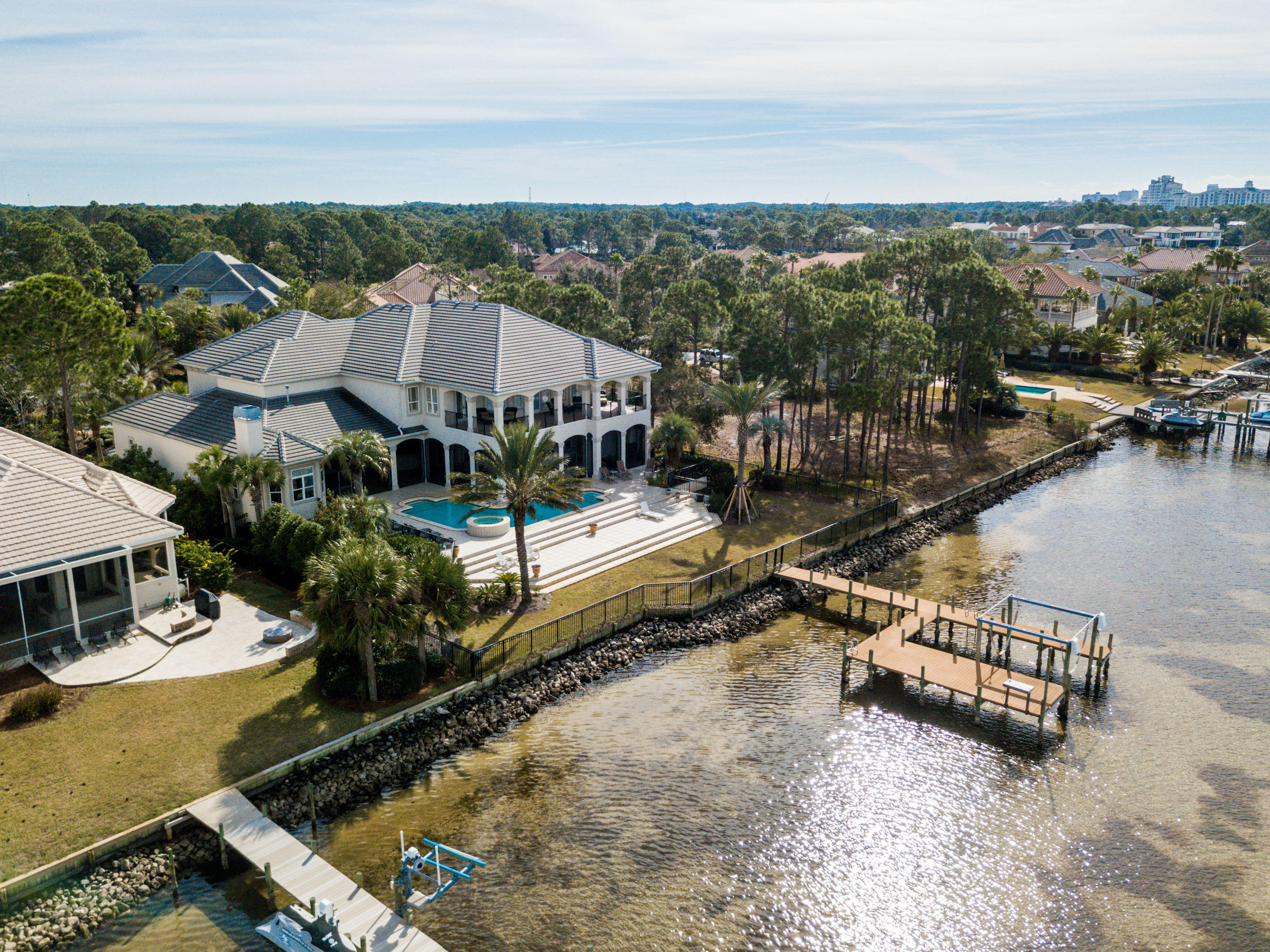 Amazing Bay Front Estate Home located within the double gated community of Burnt Pine at the Sandestin Golf and Beach Resort. Unobstructed views of the Choctawhatchee Bay from almost every room of this beautiful, one of a kind, custom built residence. Never before offered for purchase, you will not be disappointed with the infinite list of high end finishes throughout. Enjoy the beautiful sunrise every morning from the main level Master Suite which features double trey ceilings, fireplace, sitting area, french door access to screened lanai, and separate his and her closets. Spacious Master Bath with every feature you would expect including a round jetted tub. Chef's Kitchen includes Viking Professional Grade appliances, separate wet bar, and casual dining space with unobstructed views