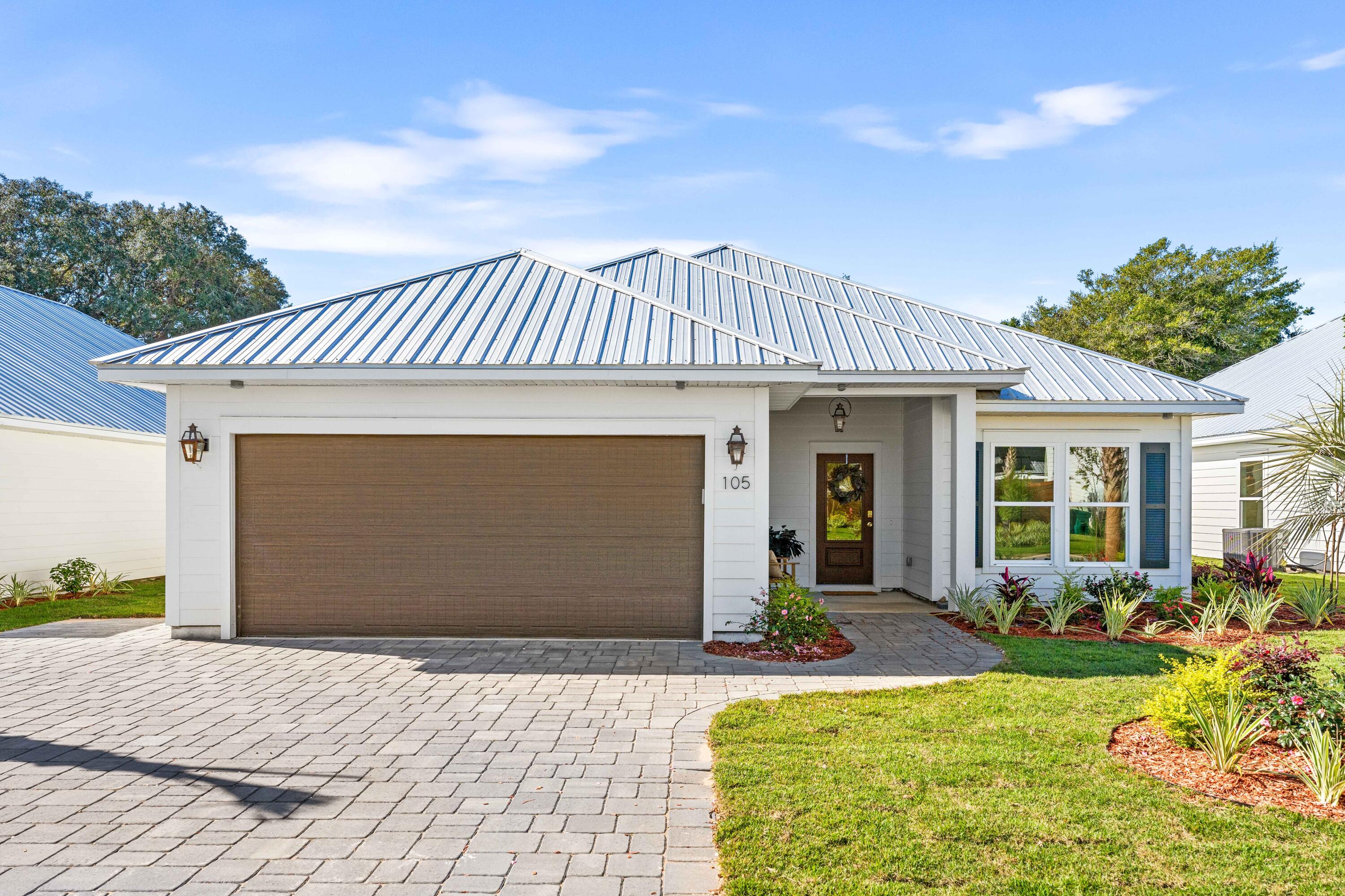 Experience the rare blend of new construction and classic charm at The Destin Cottages--a gated enclave of just 12 coastal homes nestled in the heart of Old Destin. Charming features like elegant paver driveways, farmhouse-style cement board exteriors, and enchanting natural gas lanterns create an inviting ambiance, complemented by lush landscaping. Each home includes a full gas appliance package, Navien tankless water heaters with recirculation pumps, metal roofs, front porch gas accent lights and luxury vinyl flooring throughout. Enjoy thoughtful touches like rain showers and soaker tubs in the primary bath, wood shelving in the pantry, golf cart pads, and Sentricon pest protection stations. With the HOA maintaining the front yard and a community-managed well irrigation system, every detail is designed for ease and enjoyment.

Surrounded by the vibrant lifestyle Destin is famous for, this neighborhood is just minutes from the beach's sugar-white sands, the Bay, Harbor, Pass, and Crab Island. Imagine hopping on your golf cart for lunch,  or catching a floating tiki to Crab Island just a mile away. Enjoy an evening stroll to Harborwalk for a casual dinner before retreating to the serenity of your coastal cottage.

The gated community offers convenient entry from Kelly Street and exit onto Sibert, providing quick access to the Destin Pass while feeling worlds away.

If you're seeking a new home with coastal charm in revitalized Old Destin, let The Destin Cottages become your retreat in this timeless community.