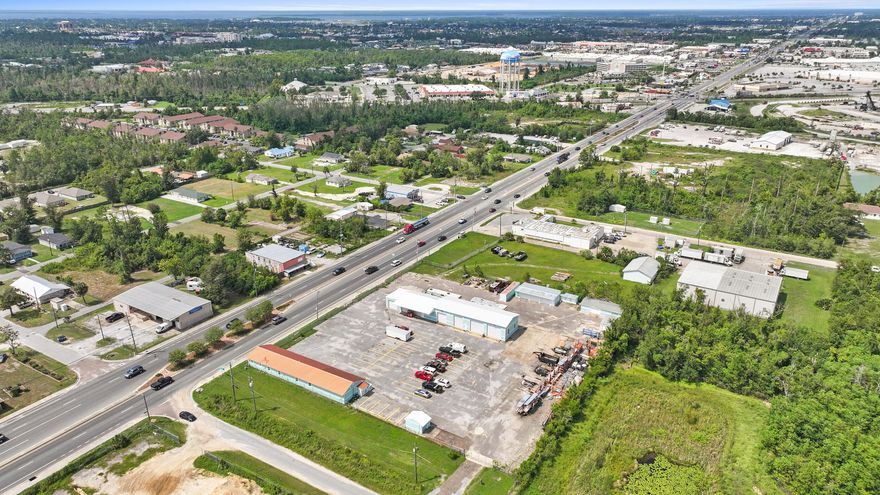 This property is a perfect location for any construction services, industrial services, or a manufacturing business. This is a 1.86 acre fenced in lot with an electric security gate. Property is conveniently located to main roadways including Hwy 231, Hwy 77, Hwy 98 and 23rd St. Highlights include 2875 sq/ft of office and 4257 sq/ft of warehousing, asphalt slab approx. 162' x 162', with plenty of greenspace, and extra auxiliary storage buildings. There is available access to MLK Blvd and to Louisiana Ave. The property provides approx. 345 feet of main road frontage off of MLK Blvd. Lot is Industrial commercial zoning. Recently renovated Office building includes: 5 offices, 3 bathrooms, a kitchenette, and reception area. Office has a standing seam metal roof from 2022, hot water heater 2022, HVAC 2022. Office also features an icehouse where team members can fill up coolers before going into the field. Wearhouse building has 7 roll up bay doors, 3 of which are 16ft power roll up bay doors. Wearhouse building has a 2019 screw down metal roof. This property features 37 parking spaces with plenty of room for additional parking, as well as plenty of room for additional building and expansion. No detail was spared to make this a functional and efficient commercial use property. Note there is a new survey denoting where a portion of the frontage was sold to DOT, that can be referenced. When the DOT takes over this section, they have agreed to make all necessary repairs and renovations as a remedy.