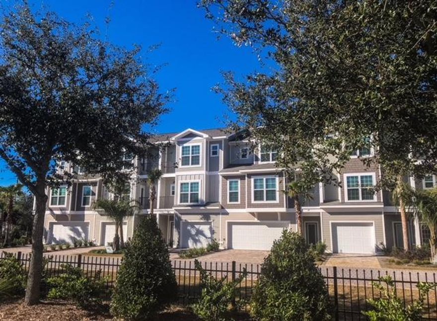 This End-Unit Townhome is just minutes from our famous sugar-sand beaches and Pompano Joe's restaurant. As an amazing investment potential this 5 bedroom, 4 bathroom, 2 car garage is 3 stories and has 2,560 sqft of space. Driftwood Townhomes were constructed in 2017/2018 as ''Earth Cents'' homes to create energy-efficient homes. The exterior has fiber cement board siding and impact windows.  The garage door is insulated, the garage floor is tiled and the hot water heater has a built-in dehumidifier. The kitchen has granite countertops with Frigidaire Gallery stainless steel appliances and a custom-made Maplewood island. There is porcelain tile flooring on the first floor and in all the bathrooms and 3/4'' oak hardwood floors throughout the rest of the home. The ceilings are 9' with