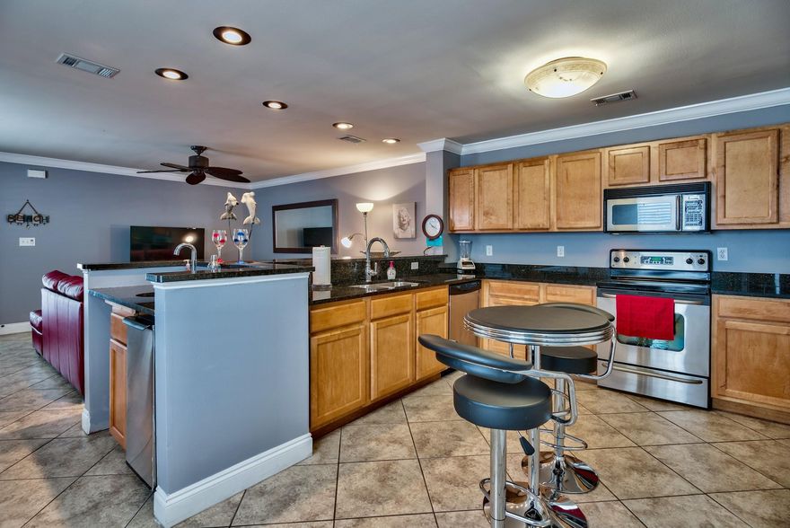 Charming townhome in Destin with beautiful interior upgrades! Immaculate home that features a spacious living room that opens up to the kitchen and breakfast bar. Large kitchen with stainless appliances, granite counters and lots of custom wood cabinets. Crown molding, upgraded ceiling fans and fixtures, beautiful 18x18 tile throughout the first floor. Most furnishings on the 1st floor convey including the washer and dryer! Two master bedrooms upstairs with separate full baths and walk in closets. Large one car garage with room for storage. NO HOA FEES! New fence and 2 private patios! AC unit is 2 years old! End unit with additional parking for a boat or small rv. Property has been used as a second home and has been well maintained! Schedule your showing today!