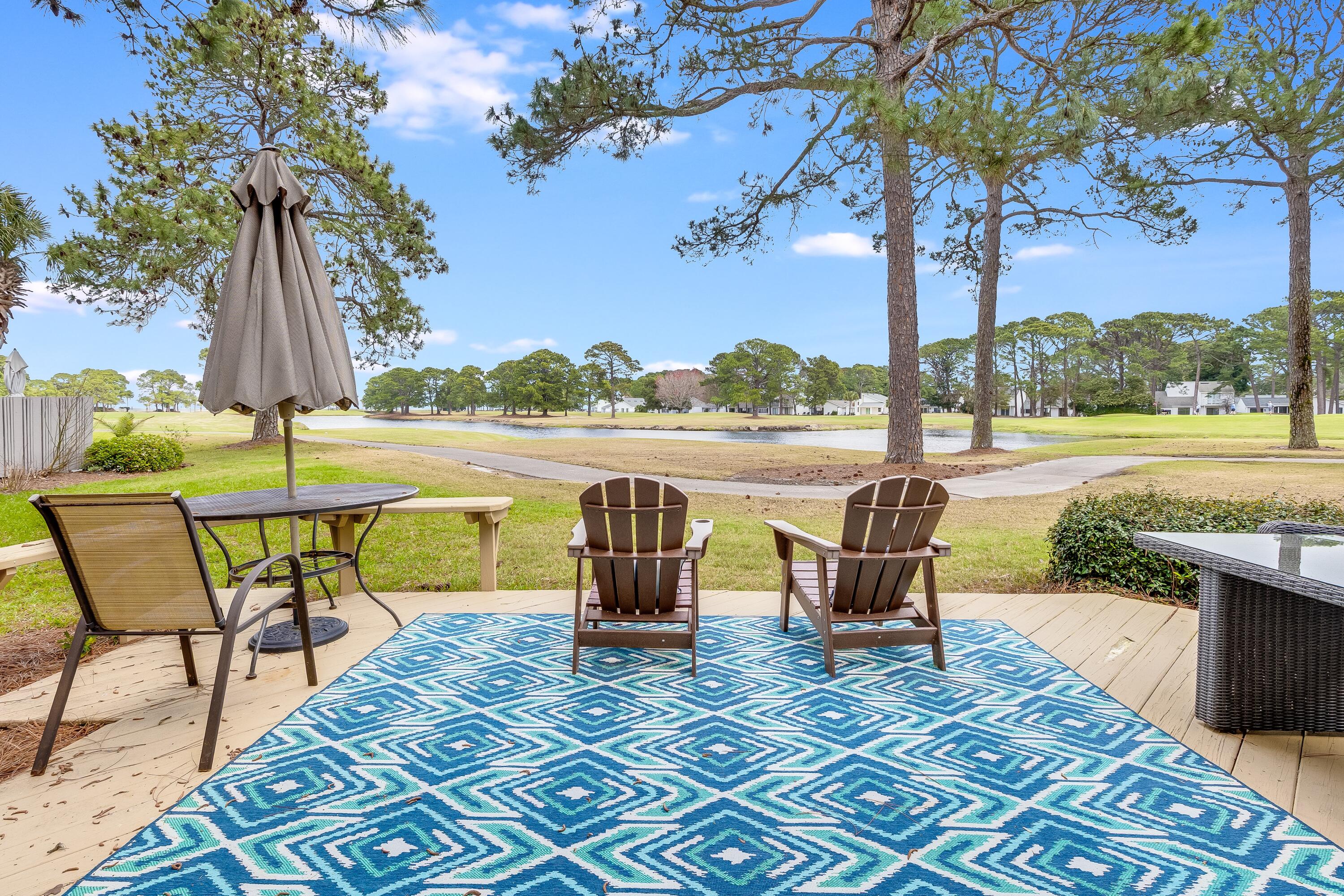 This exceptional floor plan (allows for expansion of LR and patio with HOA approval), offers a charming townhome in Sandestin's highly desirable Fairways neighborhood, boasting one of the best golf, lake, and bay views. Sold fully furnished, rental-ready, it features three bedrooms--one on the main level, another upstairs, and a versatile loft enclosed as a third bedroom. The spacious kitchen with a breakfast bar overlooks breathtaking views, visible from the kitchen, living room, dining area, upstairs bedroom, and private patio. Recent updates include fresh paint, new flooring in the living/dining area, and an AC unit replaced in 7/2025. The hot water heater was updated in 2019. A new SOA heated pool just opened in March, and a golf cart is included for added convenience Whether you're looking for a primary residence, a vacation home, or a short-term rental investment, look no further!
As an introduction to the Sandestin lifestyle, we invite our new owners to explore amenities that make Sandestin special. The listing brokerage and seller(s) are presenting the buyer(s) of this property with (2) 90-minute rounds of Tennis court time, a golf foursome at one of our three championship courses, and a round of golf for up to four (4) players at the unrivaled Burnt Pine Golf Club.
Sandestin Golf and Beach Resort features more than seven miles of beaches and pristine bay front, four championship golf courses, 15 world-class tennis courts, a 226-slip marina, a fitness center, spa and celebrity chef dining. Shop, dine and play at the charming pedestrian village, The Village of Baytowne Wharf and more. Inside the gates of the resort, residents enjoy a balanced lifestyle of high-class living, spanning the 2,400 acres from the beach to the bay. Everything within the gates of the resort is accessible by golf cart or bicycle. The entire resort is interconnected by miles of pedestrian, bike and golf cart paths that weave through groves of live oaks, meandering past natural lagoons, fountains, man-made lakes, and meticulously landscaped fairways.