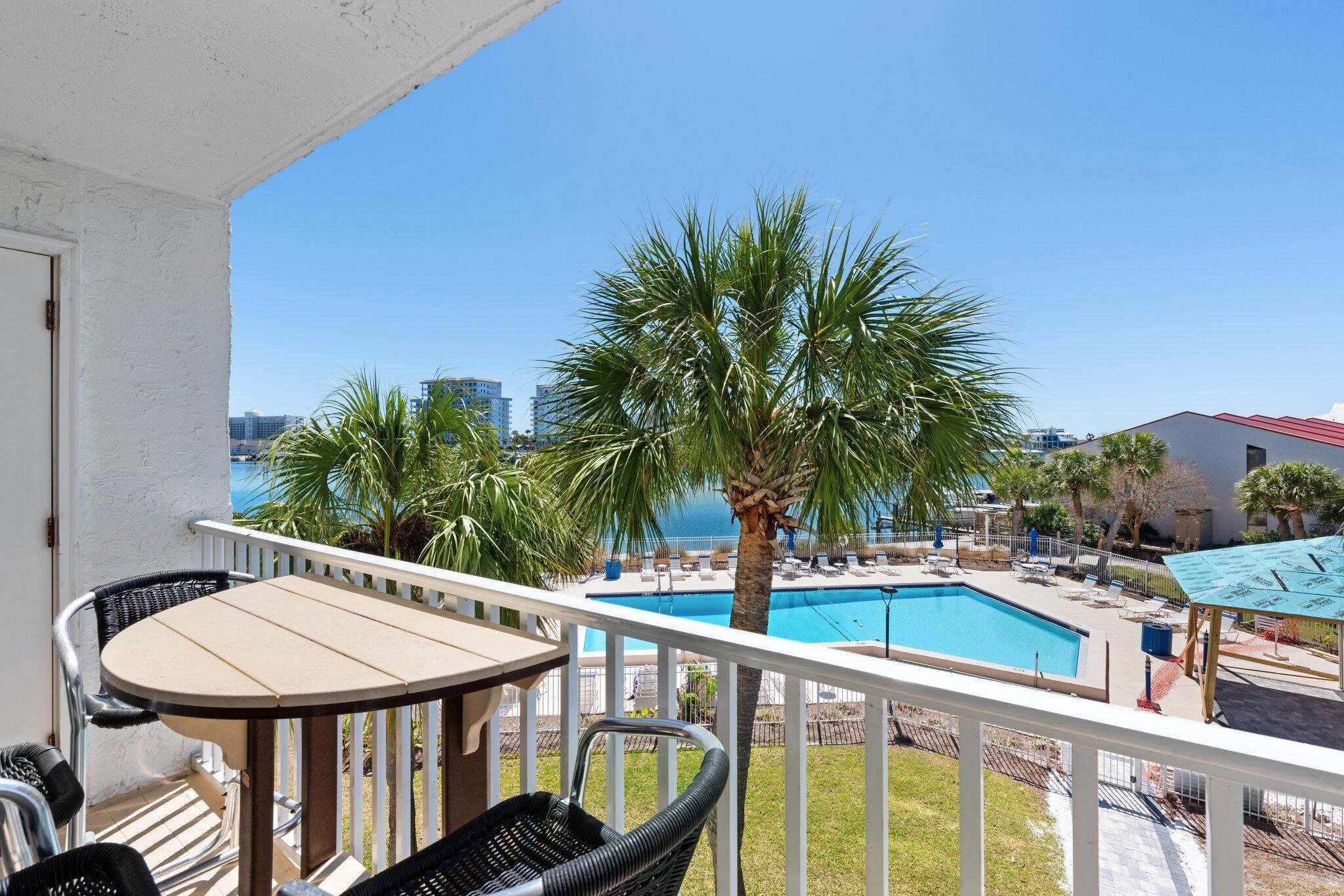 Dolphin Point is located on the Destin Harbor with Private Deeded Gated Beach Access, a community pool with beach area that overlooks the beautiful Destin Harbor/Lagoon. Unit 306C looks directly over the pool with panoramic waterfront views. There are boat slips to rent or purchase if available. Dolphin Point is soon to be gated and is 5 acres on the Destin Harbor! Newly remodeled Clubhouse is available for owners to use at no charge for Family events. DPC features tennis/pickleball courts, easily launch your Kayak or Paddleboard to enjoy the water. Unit 306C includes a golf cart with reserved parking.Dolphin Point has their own on-site management and maintenance with 24 hour security surveillance cameras. Don't miss the opportunity to see this condo located on Holiday Isle.
