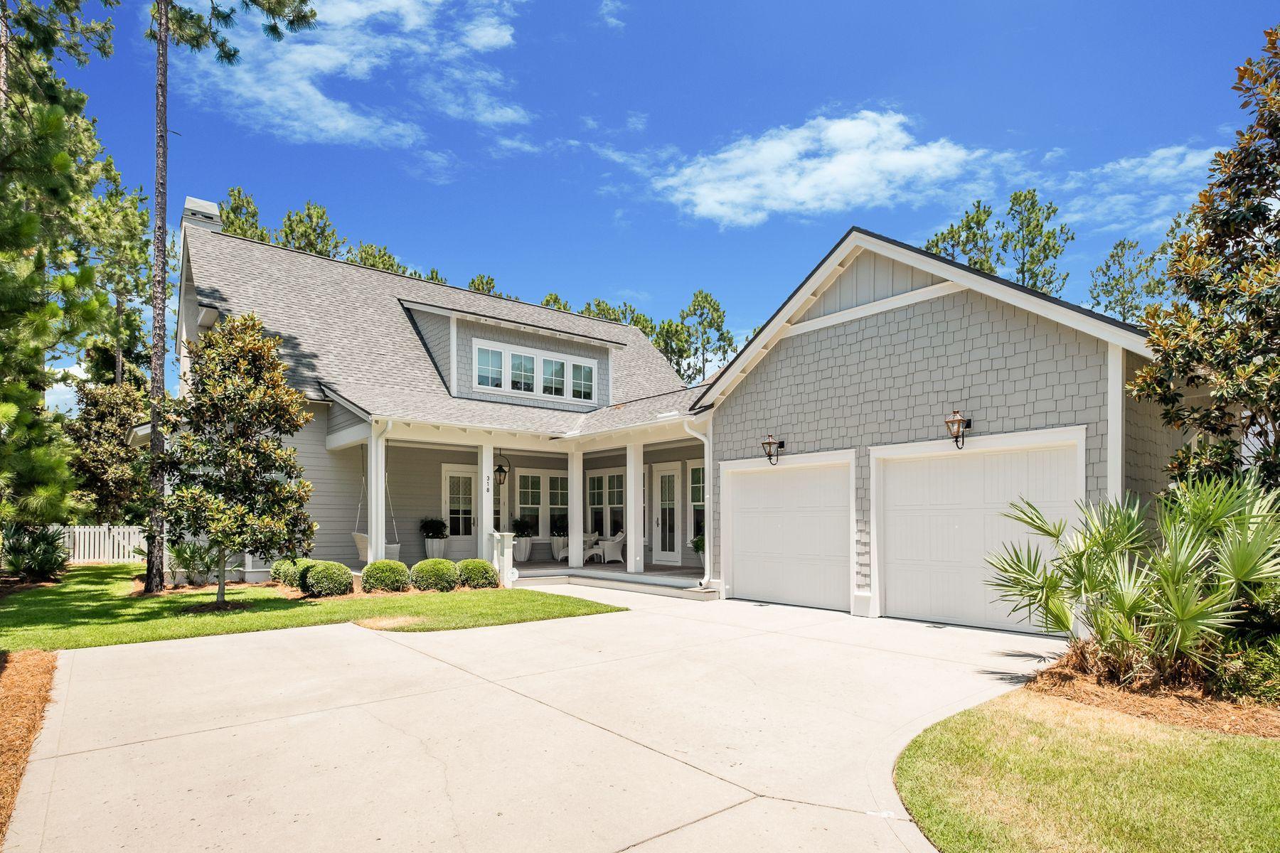 Designer Customized Show Home with Oversized Outdoor Living Spaces.A crown jewel in every sense of the phrase, the exquisite homestead at 318 Cannonball Lane is a finely curated example of coastal elegance rarely found along the Emerald Coast. Built by Romair Homes as the original community showcase home, the property was then completely remastered over a three-year span to achieve new heights of craftsmanship and detail, embodying the luxe lifestyle that golf course living in WaterSound Origins affords.The Cape Cod-inspired floor plan provides plentiful natural light and accenting crisp whites, creams and linen hues and textures masterfully paired with imported quartzite countertops, hand-scraped oak flooring and designer fixtures around every corner. Spanning nearly 3,300 square feet