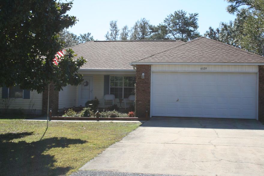 OPEN HOUSE Saturday, Feb 1st. 11:00am-2:00pm. Holley by the Sea 4/2 split floor plan with front porch, Large living area with open concept, .46 acre fenced with covered screened in back patio and lots of shade trees in the back yard. Home is clean and immaculate. AC is 6 years old. Whole home water softener system and Dimensional Roof are 3 years old. Comes with Stainless steel appliances, two refrigerators, washer and dryer. Enjoy living in this resort neighborhood with club house, pools, boat ramp, pier and recreation center.
