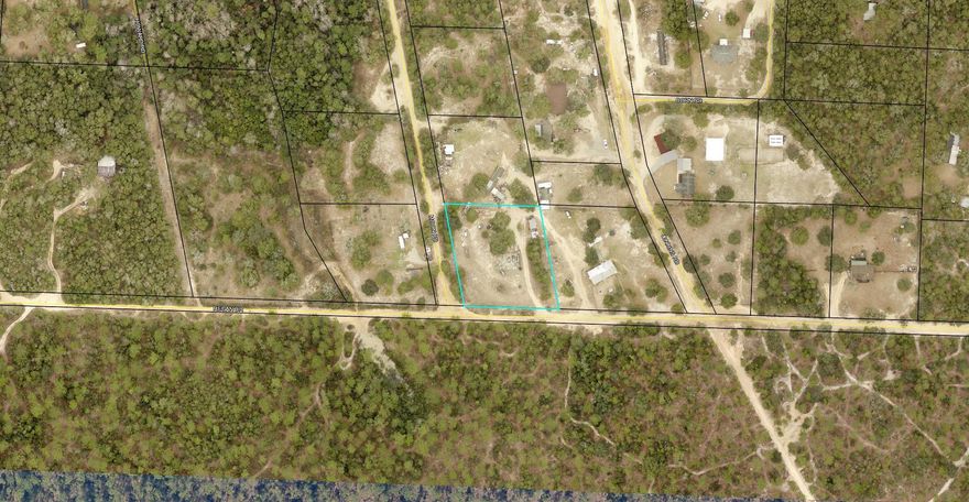Looking for land for a hunting camp or relocating to a more remote area? Cleared vacant lot available with electric hook up and a well for water. There is a concrete slab that is roughly 1500 square foot as well as a shed that conveys.