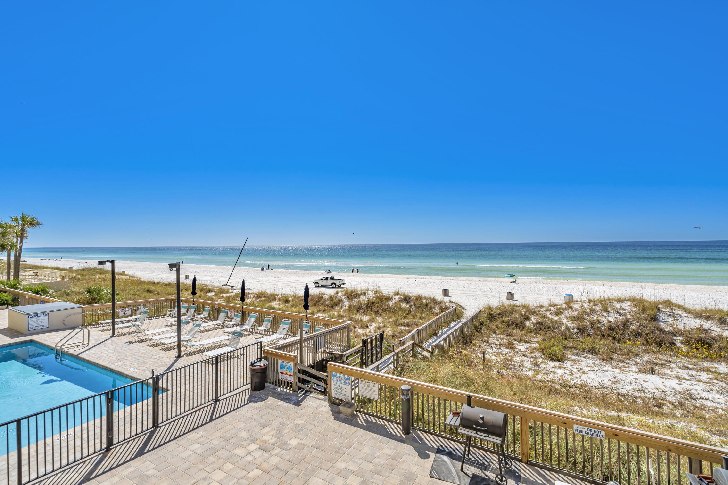 ***OPEN HOUSE - Friday, Oct 25, 1-3pm*** Invest in your future at Whispering Seas 206, an exceptional, updated condo that has consistently generated IMPRESSIVE rental income. This Gulf-front 2bd/2ba unit boasts a PROVEN track record; earning $46k in 2024, $38k in 2023 (lower due to owner usage), and $48k in 2022. Comfortably sleeping 8 guests, the condo features a king bed in the primary bedroom with STUNNING Gulf views, a queen bed plus bunk bed in the guest bedroom, and a sleeper sofa in the living room. With renovated kitchen and baths, in-unit washer/dryer, and stylish coastal decor, Whispering Seas 206 comes fully rental-ready and the option to keep it on the same rental program for easy transition. The well-equipped kitchen allows residents and guests to prepare meals with ease, the open living area provides ample seating, and the Gulf-front balcony offers the perfect spot for morning coffee or evening relaxation. Recent upgrades to the unit include a newer HVAC and water heater, hurricane glass sliding doors being installed, and refreshed furnishings throughout.
The complex itself has also seen recent upgrades and improvements to the Gulf-front pool, grilling gazebo, parking lot, and building exterior. With the Condominium Milestone Report done, Structural Integrity Reserve Study completed, reasonable HOA fees, and no pending assessments, this turnkey property offers peace of mind for residents and investors alike. Situated in a low-rise complex with only 30 units, Whispering Seas 206 offers a more calm, serene beach experience. The proximity and ease of getting from the parking lot to the condo to the beach itself is rare. Additionally, its prime location puts you within minutes to a plethora of shopping, dining, and entertainment options in East PCB, including a nearby Walmart for convenient essentials. Pier Park is less than 7 miles west and St Andrews State Park is less than 4 miles east. 
Don't miss this opportunity to own a piece of Panama City Beach paradise. Whether you're looking for a vacation home or a lucrative investment, Whispering Seas 206 delivers the perfect blend of comfort, style, and rental potential. Schedule your private showing today and start enjoying the beach life you've always dreamed of!