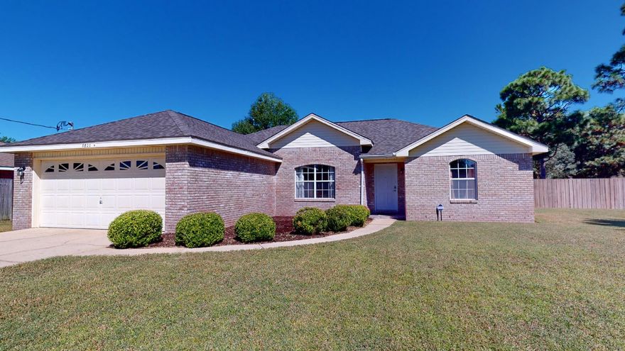 Beautiful all brick home, with new Roof situated on almost 1/2 acre in East Navarre.  This home offers 3 bedrooms, 2 baths with popular split floor plan design.  The kitchen has tile counter tops along with backsplash, no carpet in this home. Living room has a wood burning fireplace for those cozy winter evenings.  French doors leading to the covered patio where you can enjoy sitting in the morning or evenings, big back yard with privacy fence and shed for extra storage, sprinkler system w/lawn pump. Both bathrooms have new vanities.  Newer HVAC and Hot Water Heater(Less than 10 years old). This home is close to Navarre Youth Sports Association, Navarre High School, YMCA , Beaches and shopping.  Call for you appointment today.