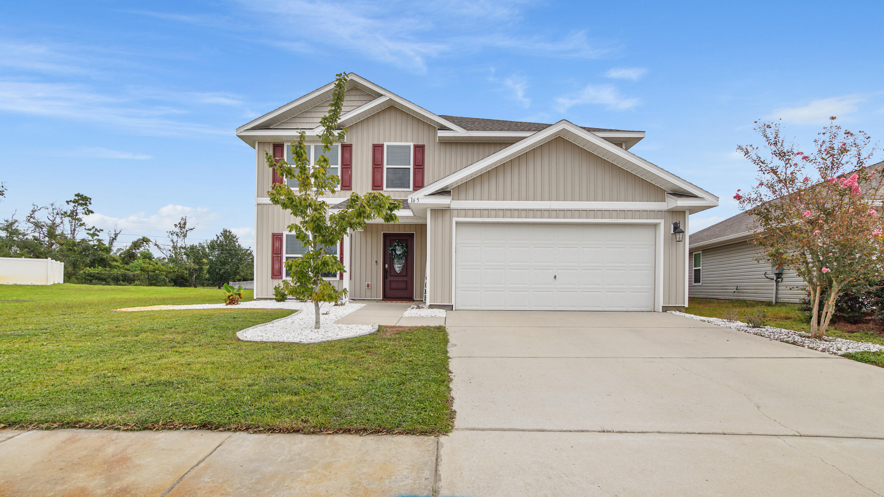 Step into this stunning 5BR, 2.5BA home with an open floor plan, 2 living areas & modern upgrades! Fresh paint, new roof & water heater (2024), no carpet (except 1 closet), Remi air purifier & smart home system make it move-in ready. The flexible dining/office space leads to a gorgeous kitchen with island, stainless appliances & pantry, opening to a bright living room. The primary suite offers a walk-in closet & spa-like bath. Upstairs, enjoy a huge loft, 4 bedrooms & full bath. Relax on the porches or in the oversized fenced yard. Community perks: resort-style pool, pavilion, sidewalks & more--just 15 mins to Tyndall AFB!