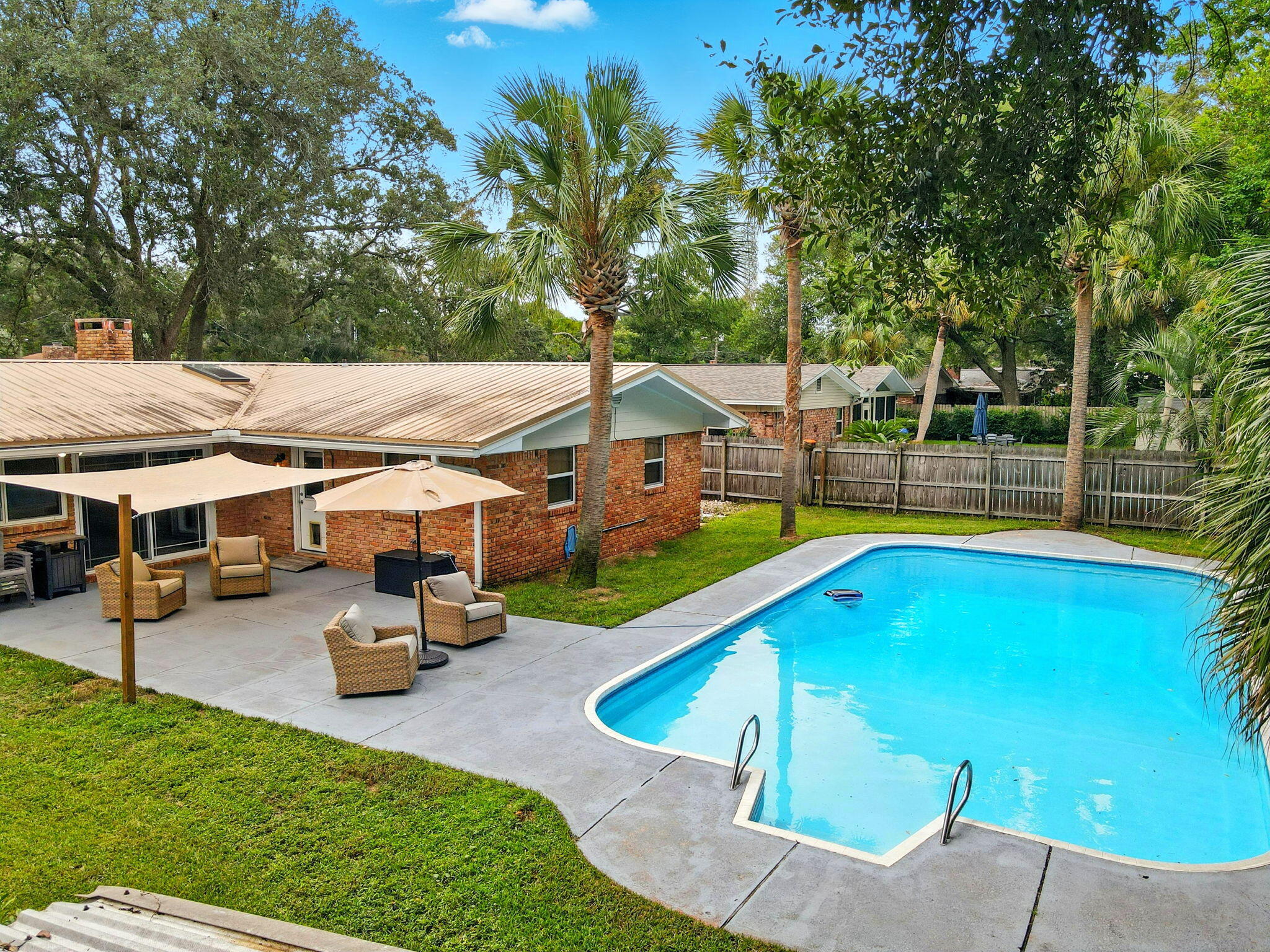 Welcome to your slice of paradise in the much desired Kenwood neighborhood! Property website: https://www.616fairwayavene.com/unbranded. This beautifully updated ranch offers a metal roof (2015), brand-new HVAC (2025), sparkling pool with new pump (2024) & liner (2021), water heater (2020), and lush St. Augustine lawn on a well-fed sprinkler system. Inside boasts fresh paint, bamboo blinds, tinted front windows, updated fixtures, anti-fog mirrors, closet organizers & a bold black fireplace. Living room opens to a private courtyard. Outside: powered shed, boat/RV parking, shaded backyard, and sidewalks throughout this subdivision. $20K in new plumbing & hurricane shutters add peace of mind--schedule your showing today!