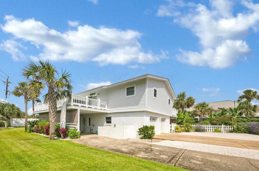 Rare property on Holiday Isle! One of the largest corner lots located steps from the beach and deep water canal access. Great 2nd home or Rental Property!The dock can accommodate a 40' boat, there is currently a 26' boat there and a 6000 lb. lift. This 5 bedroom/ 3 bath house has the perfect floor plan with the main living upstairs and a downstairs with a 1/BR 1/BA lockout unit. This home has recently been renovated with new doors and windows throughout. Another great feature is the wrap around balconies, with access from the living room, kitchen and master bedroom. There is also a 400 amp. box; 200 runs down to the dock (future plans to build the inland dock with 2 level dock house) other 200 for the home.