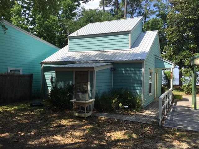 THIS COZY 2 BEDROOM/1 BATH CABIN IS WATERFRONT AND HAS BOAT DOCK ACCESS AS WELL. BEAUTIFUL OAK TREES AND BAY VIEWS ARE AMAZING. GREAT RENTAL INVESTMENT, SECOND HOME OR NICE LITTLE GETAWAY! WASHER/DRYER AND REFRIGERATOR INCLUDED. LOW MAINTENANCE, HOA DUES ONLY $300/YEAR. DOCK SHARED WITH ONLY 3 OTHER CABINS. CONVENIENT TO SOUTH WALTON HIGH SCHOOL, FREEPORT, AND BEACHES... MUST SEE !