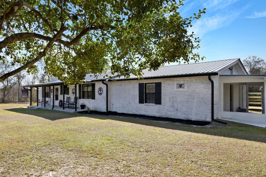 Welcome to this newly updated charming and spacious 3 bedroom 2 bath home located on a private 2-acre lot with 450 feet of paved frontage. Access the property through an extra-wide automatic ghost solar controlled gate with electrical outlets down the front fence. Just some of the upgrades are the interior is painted with Sherwin Williams HGTV Infinity paint, exterior brick is done with Rombaio Avorio White Limewash, New A/C and Duct work in 2022, new hot water heater for front of the house 2023, new tankless hot water heater for back half of the house in 2022, all new plugs switches and outlets, Fireplace completely rebuilt with new damper and custom mantel, refrigerator 2022, microwave 2022, all new fixtures,  to many upgrades to list it is a must see.