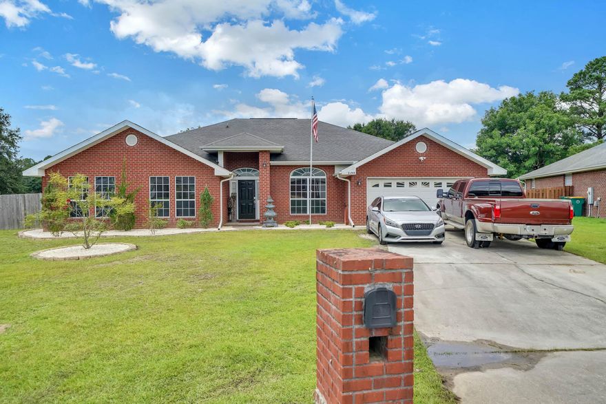Welcome to country living in a sought-after neighborhood!  This open concept 4 bedroom, 3 bath, all brick home sits on a 0.49-acre flat lot.  This home is almost 3k SqFt and feels every bit of it with the open living, dining and kitchen areas.  It boasts 8, 10, and 12 foot ceilings and has pillars through the central living area.  The kitchen has updated backsplash and lighting, barstool seating, beyond ample storage space with cabinets all around the kitchen.  The kitchen leads into the large walk-in pantry which contains wall to wall storage space.  Beyond the pantry is the designated laundry room, which also has a door leading to the back patio.  Back through the kitchen you walk out to the built-in book shelfs, fish tanks and workspace.  Desk, tanks and safe in the workspace will