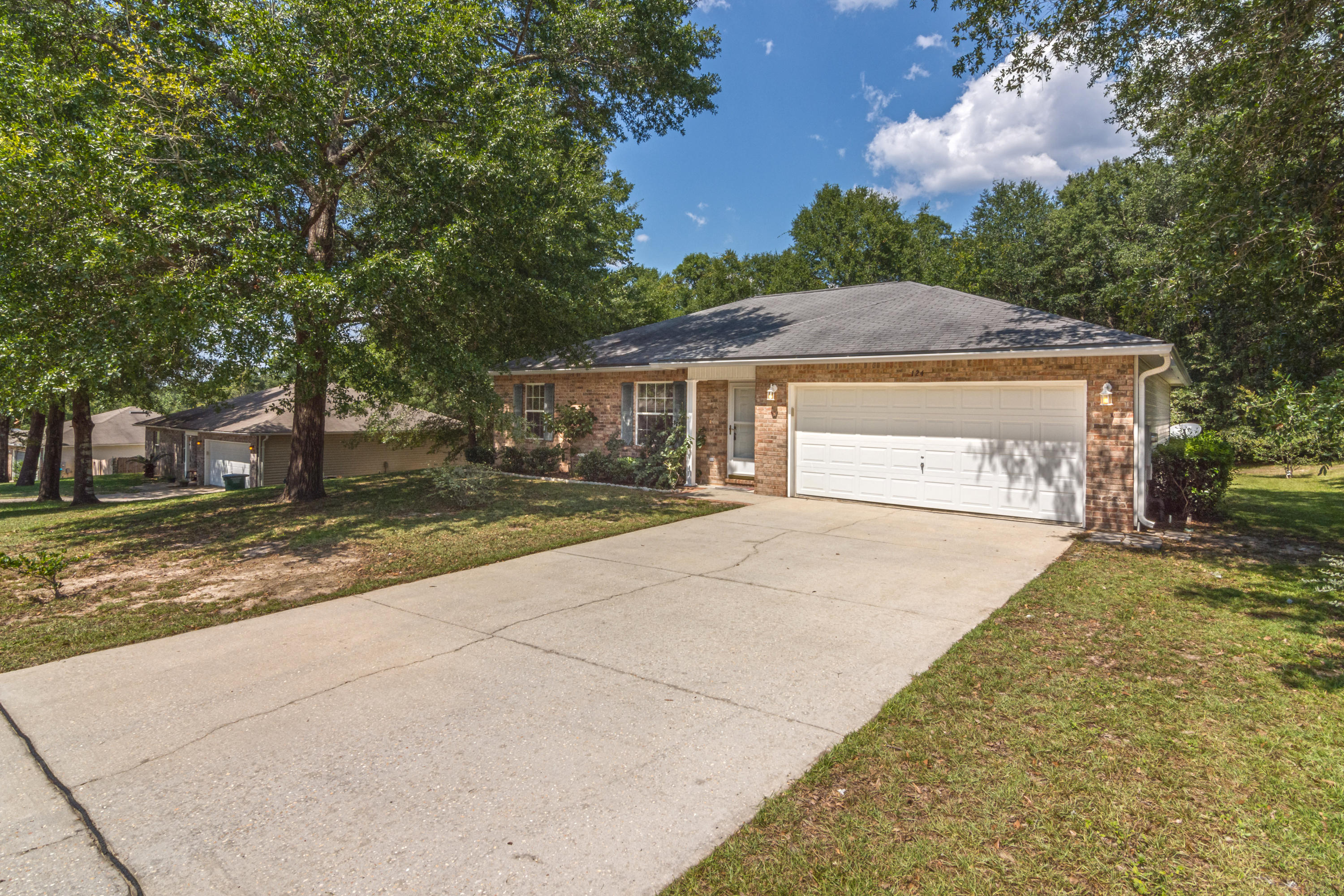 Great home in central Crestview. 3 bedroom/2 bath with good size yard. Not sloped like a lot in Ridge Crest! Large open kitchen and living area. Perfect for entertaining and never missing out. Kitchen has tons of countertop space as well as storage. Also, a breakfast bar for additional dining space. 2 car garage.