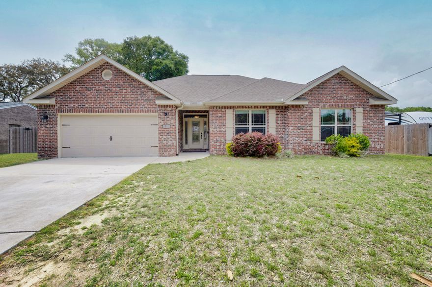 Built in 2019, conveniently located with access to local military bases, shopping and white sandy beaches. Enter this lovely home, coming through the foyer that leads you to a spacious living room with tray ceilings. Beautiful wood plank tile carries throughout the house except in all bedrooms that are carpeted. The kitchen/breakfast bar has beautiful cabinetry and granite counter tops. Beautiful island in kitchen for those who love to cook and need the space. Master bedroom has a beautiful tray ceiling with master bath having garden tub with separate shower and double granite vanities. *Sellers have a 'Land Use Change' filed for the area the camper is parked.