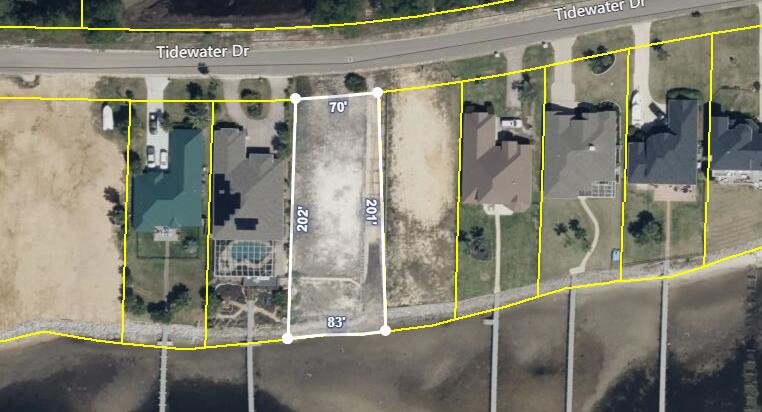 Ever dreamt of dolphins as your neighbors? Introducing the ultimate waterfront retreat where the only noise complaints come from seagulls! This sound front lot in Navarre is your ticket to sunset symphonies and pelican parties. With 180-degree views of nature's canvas - from playful dolphins to the occasional off-key boat horn - you'll enjoy daily concerts conducted by Mother Nature herself. Perfect for anyone who wants to paddle their own canoe (literally, we've got a kayak ramp). Seize the seashells - it's time to serenade yourself seaside! The lot has had many improvements including 180' retaining wall along easement, gunite wall on the sound side, rip-rap seawall on water's edge, sewer, water and tap fees paid. The ground level of the lot has been elevated by 10 feet to street level