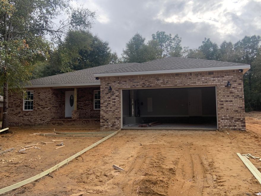 New construction in North Crestview with a custom built feel! Beautiful designed brick contemporary plan features a 3 bedroom, 2 bath open split concept. As you enter this home you begin to experience this builder's detail from the front Porch finishes, Flood lighting, Tray ceilings, Crown molding, 5 1/2 inch Colonial trim, Recess lighting and Brush Nickel faucets. These are a few of the touches you'll find in this home. Custom tile in the wet areas with builder grade carpeting in the living room and bedrooms. Kitchen has a nice sized island which overlooks the living area for those who like to entertain. Upgraded kitchen cabinetry with granite counter tops in kitchen and a stainless under mount steel sink. Stainless appliances include: electric range/oven, microwave, and dishwasher.