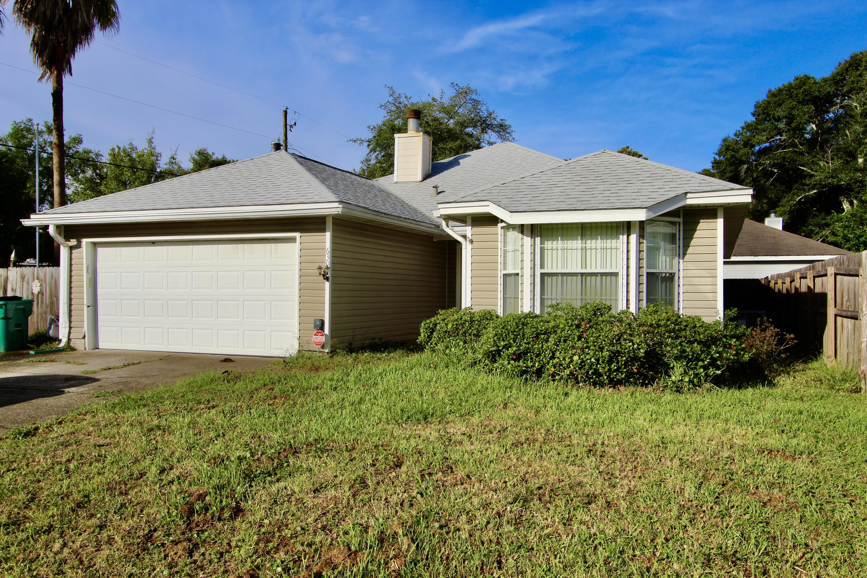 Pictures are from previous lisitng in 2022. This 3 bed 2 bath home is conveniently located close to shops, schools, beaches, and bases. When you enter the home you will notice the large living room with a cathedral ceiling, gas log fireplace, and built in shelving. Split floor plan, the guest rooms are off the living room and the master is off the kitchen area. As you cross the living room you will find the kitchen and dining room area that has an exit to the covered patio and fenced in yard.  Roof was replaced in 2017 and there is a 15 kW 60 Hz GUARDIAN PLUS AIR-COOLED HOME GENERATOR by Generac