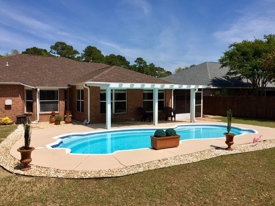 Immaculate 4 bedroom 2 bath Brick POOL home ready for new owners! Owners have meticulous updated and upgraded this home with $35,000 worth of updates including brand new ROOF, custom barn door, new baths, new fridge, new paint, new light fixtures, new landscaping with rocks and on & on. 4 bedrooms plus dining room and Florida room overlooking your own in ground pool. Privacy fence highlights the backyard oasis with extensive landscaping. Updated kitchen and both baths feature new vanities, toilets and glass door in master bath. Open living, updated, immaculate pool home- a must see!