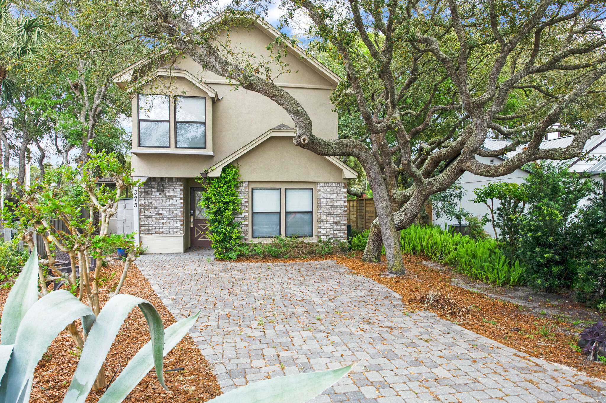 373 Pelican Circle is located in the gated gulf side community of Camp Creek with its own PRIVATE deeded beach access. Enjoy the 30A lifestyle that will delight your senses in this beautiful and inviting 3-bedroom home ideally located on the south side of Highway 30A. The main living space is an open floor plan concept with a spacious living room and kitchen and a lot of natural light throughout. The kitchen has been upgraded with modern stainless-steel appliances. Two of the three bedrooms have their own ensuite bathrooms. Out back you will find a beautifully landscaped yard with stone accents and lush greenery.Inlet Beach offers many dining and entertainment options and is in close vicinity to Seaside, Alys & Rosemary Beach.