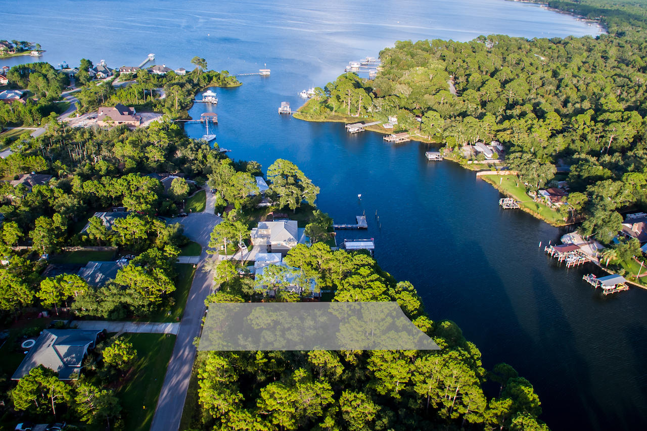 Gorgeous Deep Water Lot on Buck Bayou, also known as Honeymoon Cove. This lot has just been recently surveyed and cleared. 78 Feet of water frontage with gorgeous views. Perfect location to build your dream home on the Emerald Coast. Boat dock was permitted back in the early 80s and needs some TLC.