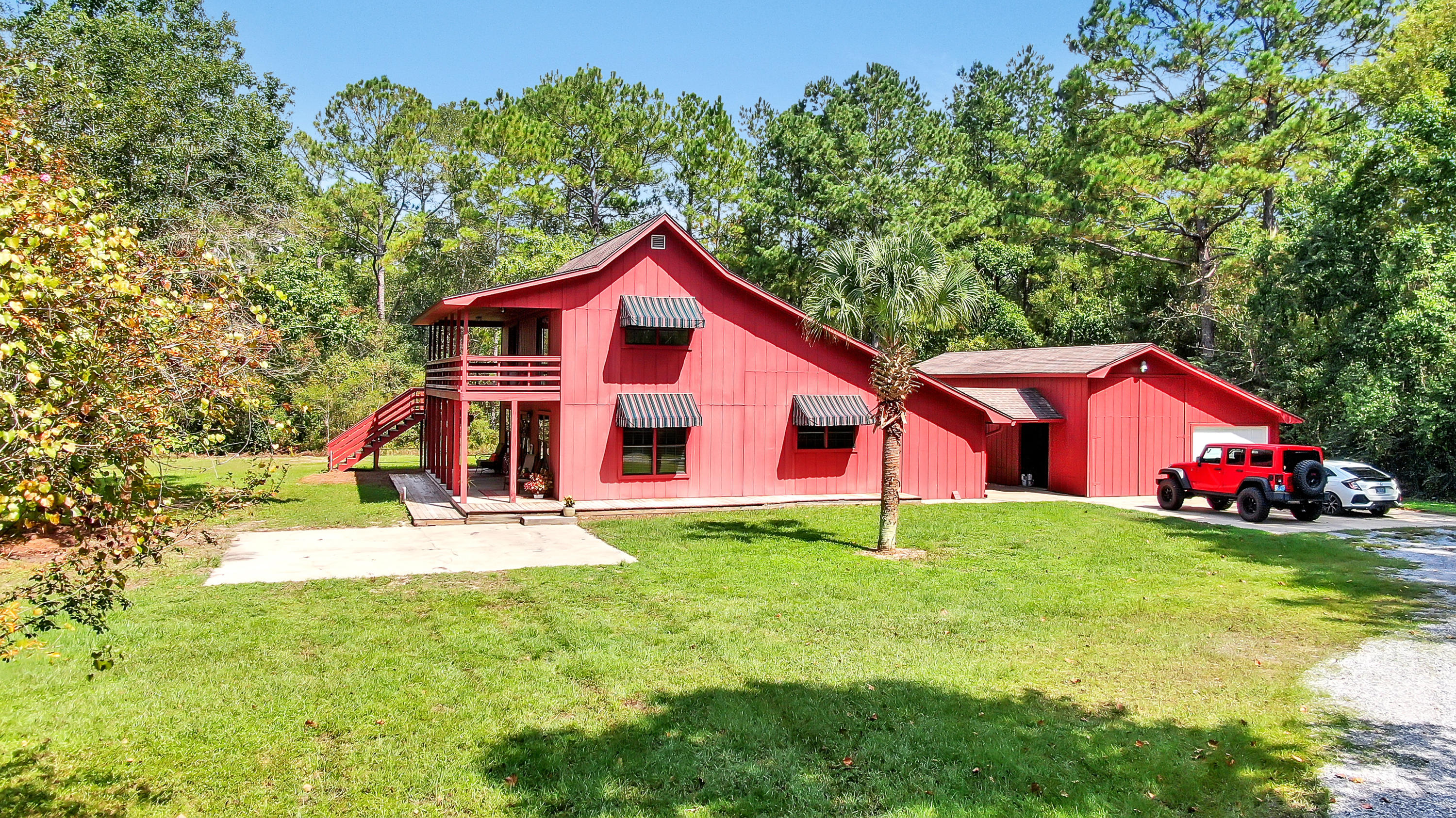 An oasis in the middle of the city? Yes! And this totally private, renovated creekfront farmhouse has SO much character. The kitchen with wood beam ceilings, butcher block counters, pantry, and utility/mudroom are perfectly appointed. The open living and dining room leads out to your covered porch overlooking the creek. The downstairs master suite with soaring ceilings and completely renovated master bath with double vanity & all tile shower is a delight. Upstairs you'll find 2 beds and 1 large full bath with separate vanities also. There's an upstairs deck as well overlooking the creek & back yard. There is so much storage inside and out, including the attached barn to include RV parking also.