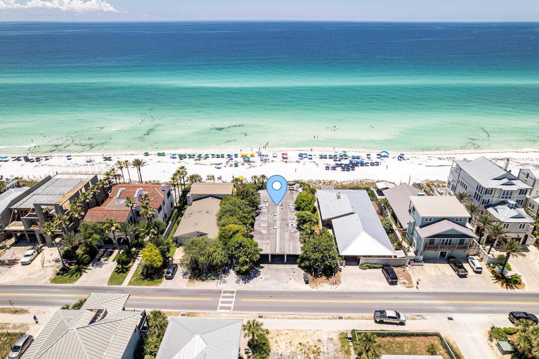 One of the last of it's kind. A quintessential 50's gulf front cottage located in one of the most desirable locations in our region. Just adjacent to Seaside, the lot boasts an impressive 60' of width along the sandy white beaches and emerald colored waters of Seagrove Beach. Enjoy elevated views from atop the dune as you soak your cares away in the hot tub. The home is currently being utilized as a vacation rental and features a split bedroom plan of 4 bedrooms & 4 baths. Centrally located in the home is a open concept that joins the living/dining/kitchen/foyer areas. The new owner will enjoy a multitude of options ranging from keeping the home as-is, embarking upon a remodel, or utilizing as a vacant lot to build their dream home in one of the most prestigious locations on 30A. Embrace