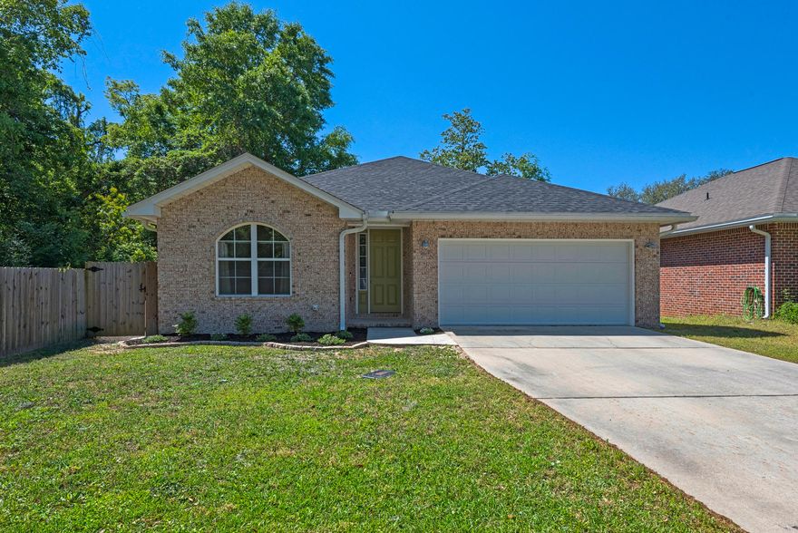 Welcome Home to Bay Breeze Cove! This like-new home is exactly what you've been looking for! With peek-a-boo views of the water, this home is located in walking distance of Boggy Bayou, marinas, and Lions Park. Nestled on a corner lot in the quiet and secluded community of Bay Breeze Cove, you will find this fantastically maintained, original owner home. Built in 2013, this home is still like new! The open floor plan includes 3 bedrooms/2 baths, a large center island kitchen, stainless steel appliances, a large pantry and laundry room, and an oversized eat-in kitchen/dining area. The partially covered back deck is great for grilling and relaxing in the fully fenced back yard. Get your lawn chairs ready - you'll be able to enjoy fireworks over the Bayou directly from your back deck! Priced