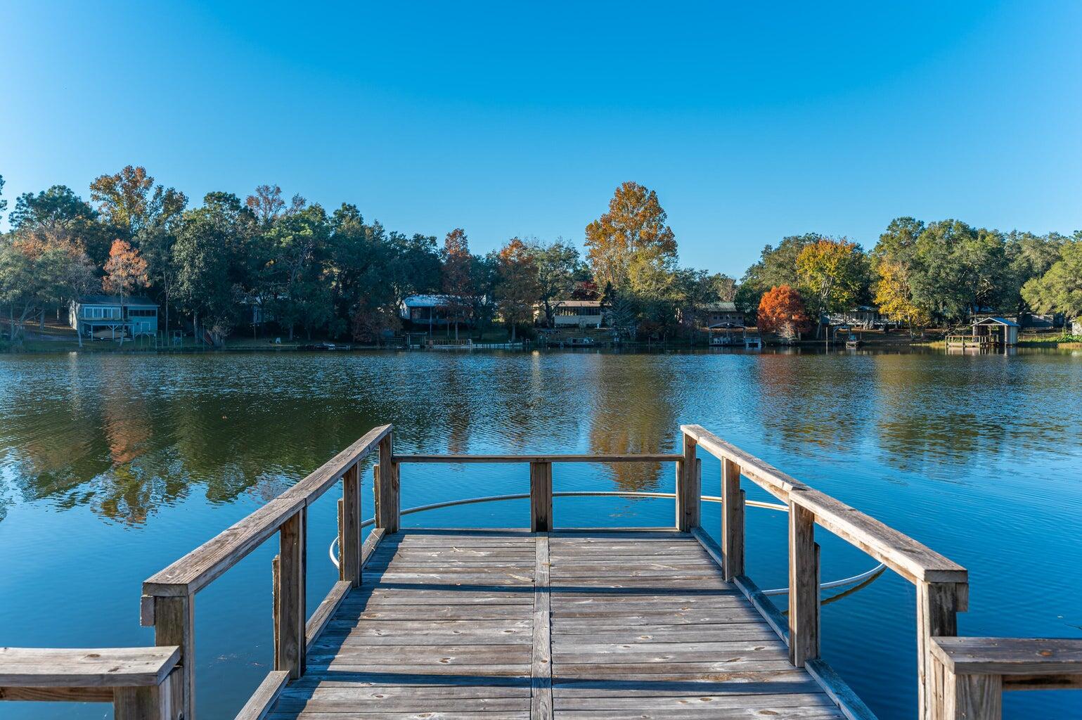 Charming manufactured home on beautiful Juniper Lake! Home features 3 bedrooms, 1 1/2 baths, two living areas, step outside to your private dock and take in the stunning lake views with almost 80 ft of lakefront footage! This home sits on a fenced, large 1/3 acre lot.