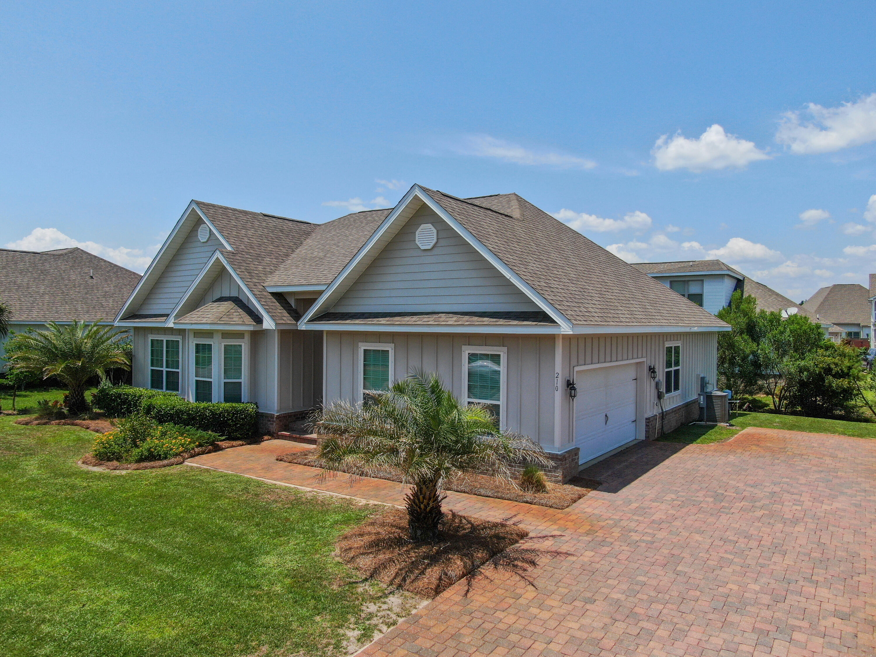 Location, location, location! Call this beautiful, 2,075 sq foot, one-level, 3 bedroom/2 full bath with a 2 car side entry garage your new home. This house was built in 2015, and is located in Cypress Breeze a gated community just walking distance to Gulf Place. Discover why this community is so popular. Enjoy coastal living at its very best. Only 1/2 mile to the public beach access, shops and restaurants at Gulf Place. You will love this open concept floor plan with high ceilings. The kitchen comes with granite counter tops and stainless steel appliances and a pantry. Entire home has a beautiful title floor throughout. Rent includes yard maintenance. Tenant to pay for all utilities and renter's insurance. Application will include a credit check. No cats please. Small dog with pet deposit