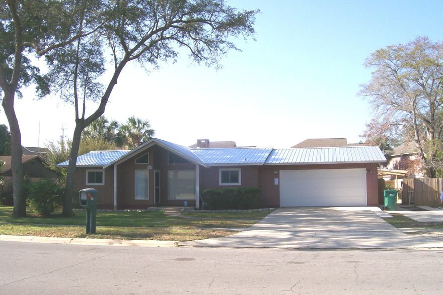 Its ready! Access the pool from the Master. $2000 flooring allowance for this special home. It has character and it separates itself from the others. Popcorn ceilings scraped,New roof & soffits completed in December 2016. http://view.paradym.com/3932705 shows the old roof. With an open living area, this home invites you in and doesn't disappoint from the front foyer to the way out to the pool. It's move in ready, the kitchen cabinets sparkle, the high ceilings (with no popcorn) and crown molding are delightful. Enjoy outdoor Florida living with the space for dining and entertaining around the pool. This is your opportunity to own a great pool home that you and your family can enjoy for years to come.It has a fully fenced back yard and a spacious yard building. Call today to take a look.