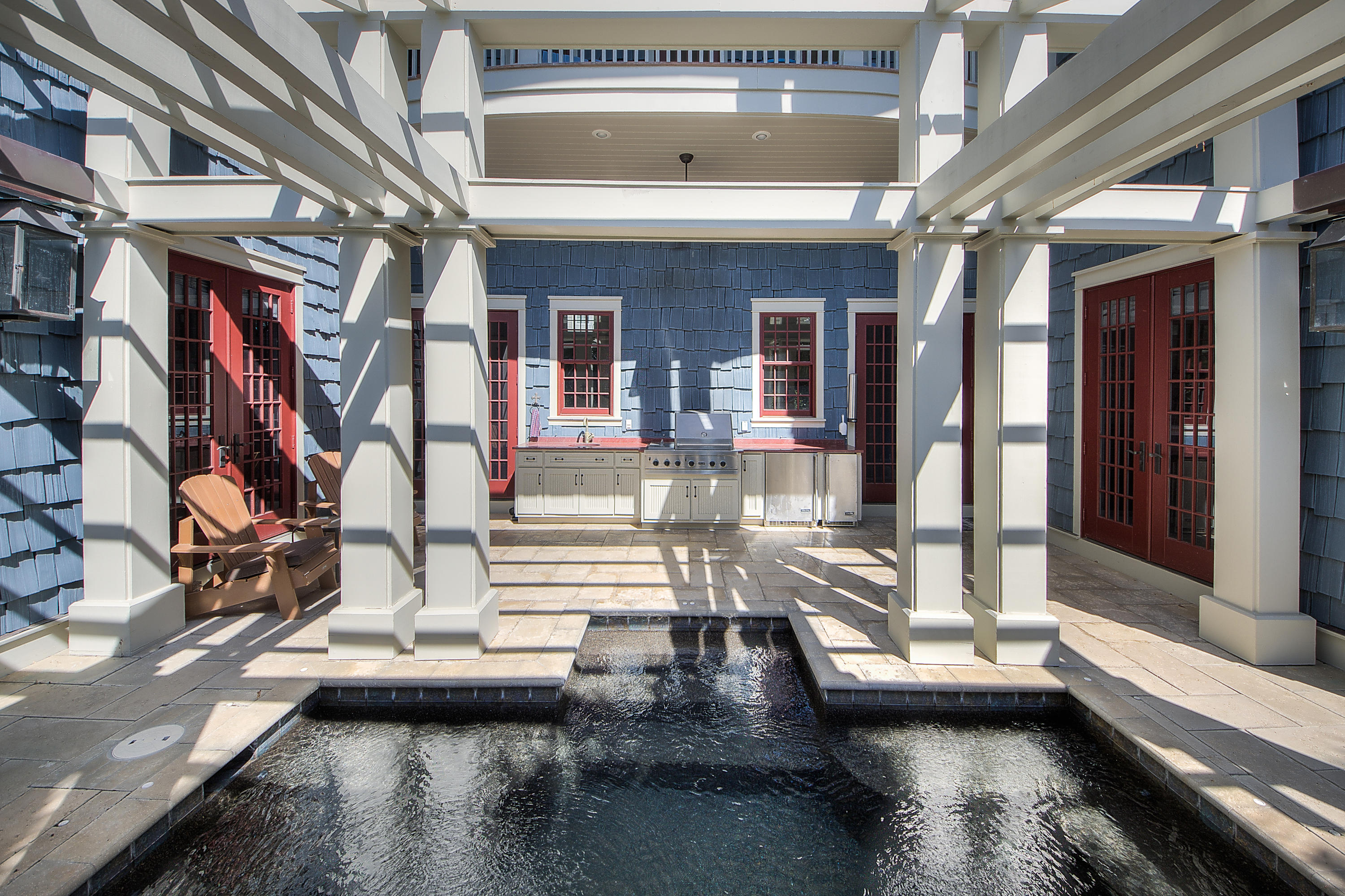 This custom designed residence in WaterSound Beach sits on an oversized corner homesite. Built by Regal Stephens Builders & sold furnished no detail was overlooked. One immediately appreciates the 13' ceilings, walnut floors & skillful millwork of the trim, doors & cabinetry. The gourmet kitchen with Viking appliances & custom cabinetry with roll-out shelves is a chef's dream.The dining & living room have an abundance of natural light streaming through the plethora of windows which accent the open floor plan. The first floor master bedroom has a spacious ensuite with separate soaking tub & walk-in closet.A second master bedroom with enormous ensuite, two additional guest bedrooms & full bathrooms, media room & full bathroom complete the second floor. The private outside retreat is amazing