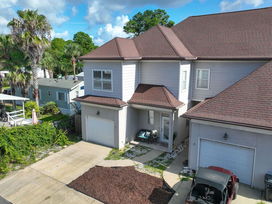 Located just three blocks from the shore and priced well below appraisal value, this stunning townhome offers the perfect blend of comfort, convenience, and investment potential. Whether you're looking for a second home or a lucrative rental, this unit is sold fully furnished and designed for effortless coastal living. The open-concept layout boasts a bright and inviting living and dining area, complemented by a well-appointed kitchen featuring stainless steel appliances, ample cabinet space, and granite countertops. The first floor impresses with soaring 10-ft. ceilings, enhancing the sense of space, while a half bath adds convenience. Upstairs, the primary suite serves as a private retreat, complete with a spa-like ensuite featuring dual sinks, a walk in shower and two walk in closets