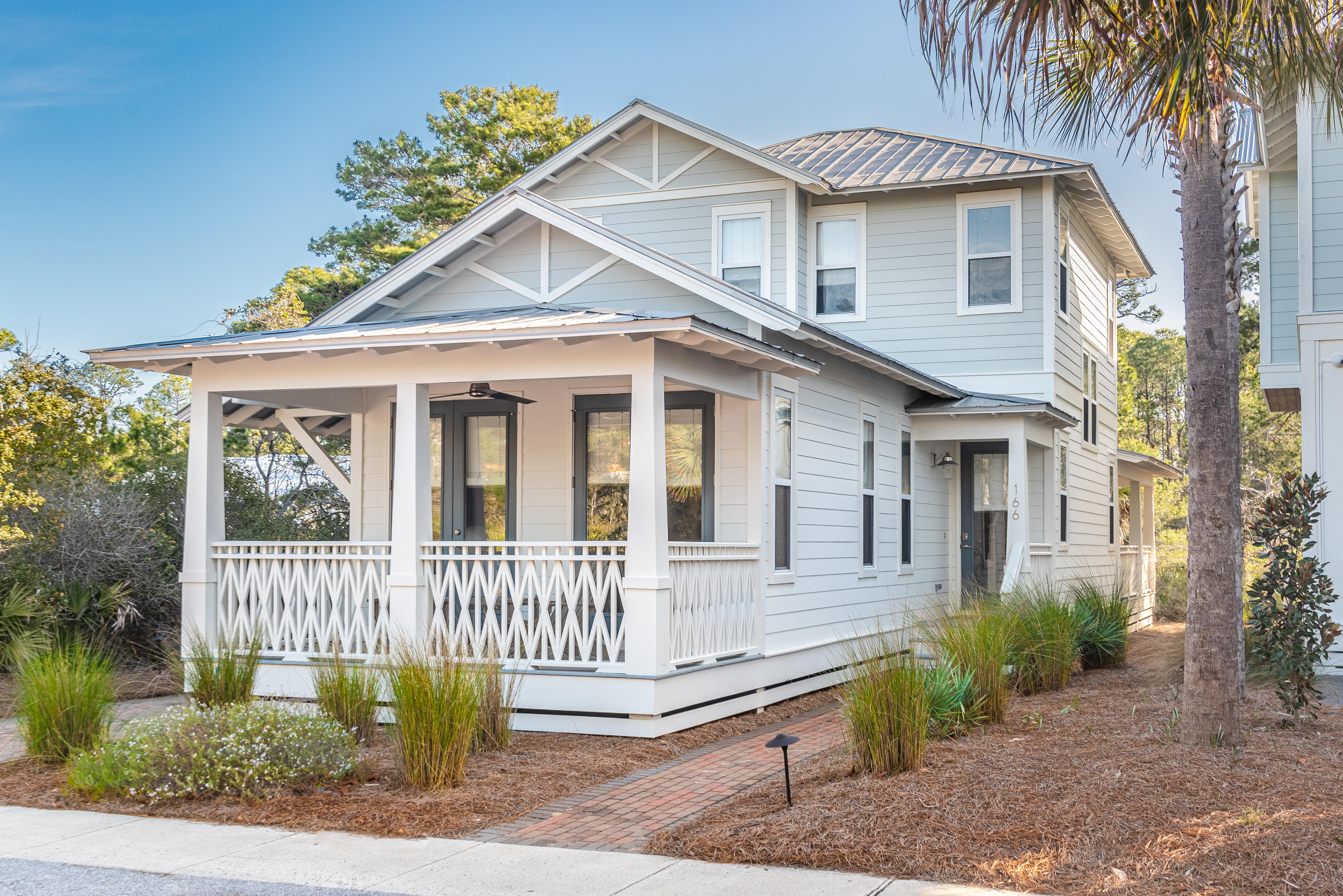 Find charm and function at this gorgeous 3BR/3.5BA beach cottage in the popular Seacrest Beach community, just steps away from both Alys Beach and Rosemary Beach. Tucked away in a quiet location with nature preserves behind the home, enjoy beautiful wooded views from ample porches. Multiple updates throughout have kept this property looking and feeling new such as designer light fixtures and fresh interior and exterior paint. Light, bright and open living and dining areas make entertaining seamless including a kitchen with a large breakfast bar with seating for six. The first story master suite features French doors that lead directly to a cozy porch along with a master bath with separate vanities, a rain shower and a jacuzzi bathtub. Upstairs, find a second master suite with private porch and a bunk room and an additional bathroom. This home has an excellent rental history and is being offered move-in or rental ready with high-end designer furnishings. The Seacrest Beach community boasts outstanding amenities including a 12,000 square foot multi-level lagoon-style pool surrounded by lush landscaping, fountains, two bath houses and plenty of places to lounge as well as tram service to the beach. The lively Village at South Walton Town Center adjacent to the community offers shops, restaurants, weekly entertainment and a convenience store.