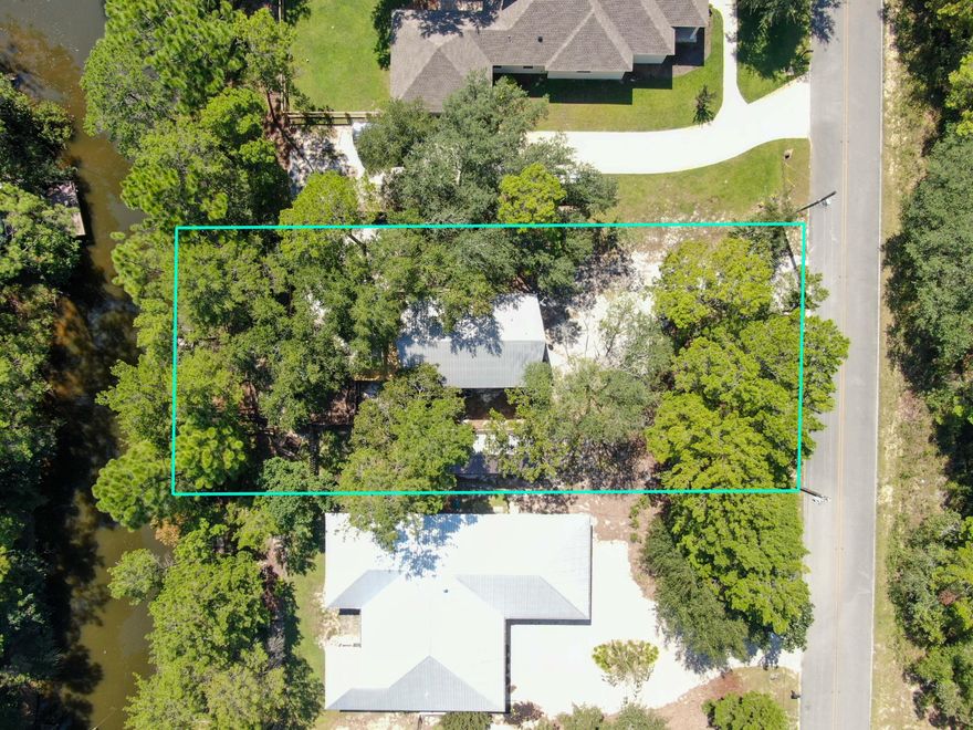 Opportunity to own canal front in popular, picturesque Pt Washington . Renovate this sweet little cabin or choose to start over from scratch and build a custom home on this 1/4 acre lightly wooded lot. With the Choctawhatchee Bay only 1500 feet from this canal front lot, you can float away on your pontoon or flats boat (as large as 21' is common) or launch kayak from the back dock. There's no active HOA to prevent expressing your own personal style. Ride your bike to beautiful Grayton Beach, just 4 miles away. Experience a lifestyle that most would envy in this well established south Walton neighborhood.