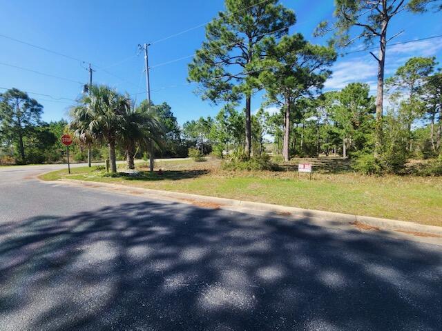 Beautiful bay view lot! Build your dream home on this wooded lot on Pearson Road across the street from the bay. Seller can construct a build to suit home on this lot. Approx. 2,500 sq ft in the price range of $599,000 depending on features and finishes. Covenants under documents. Buyer to verify all lot dimensions, covenants, zoning and utiliteis information.