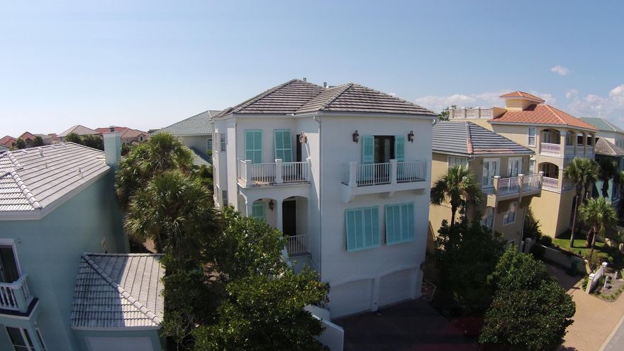 Come Live at the Beach! This 4 Bd / 4 Ba home with Gulf Views offers 3 stories of beach living. The first floor offers a mother-in-law quarters with living room,kitchen, bedroom & bathroom. The second floor features wood flooring in the living area. The kitchen offers breakfast bar & is updated with new cabinets, granite counter tops, stainless appliances including a double oven. 10 ft ceilings through out. Enjoy gulf breezes from any of the tiled balconies. Terra Cotta Terrace owners share a community pool, tennis courts & beach access with The Enclave. The home has fresh exterior paint including stucco repair. Home has been used as a 2nd home for 14 years, Please use the link for a full 3D Tour: https://my.matterport.com/show/?m=SUbqZEhWhTf&brand