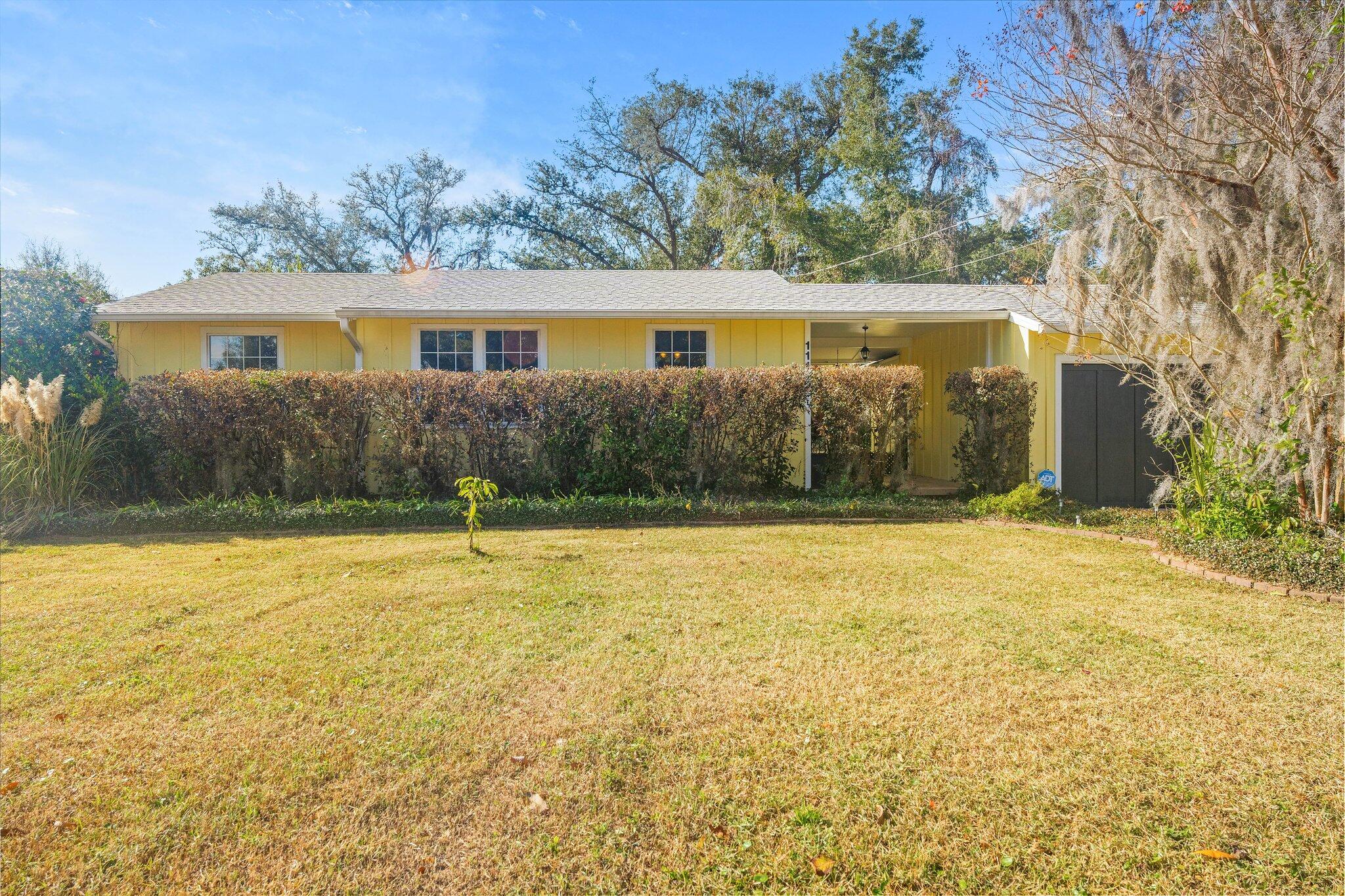 Charming 3 bedroom home in the Historic ''Old Bunker Cove'' Area. This home has been well loved with an abundance of vegetation including Crate Myrtles, Japanese Camelia , Azaleas, Jasmine, and Gardenia to mention a few. Truly a gardeners dream with rose, blueberry, raspberry bushes and lemon grass on a large .241 acre lot. Beautiful hardwood floors, renovated bathroom, updated kitchen and new range (2024), newer roof (2019), 1 car garage, large fenced backyard (2020), workshop (12x24). Conveniently located along walking/biking paths to the park, harbor, and schools. Short drive to downtown Panama City with coffee shops, shopping and restaurants. All ages, sizes and measurements approximate; buyer to verify if important.