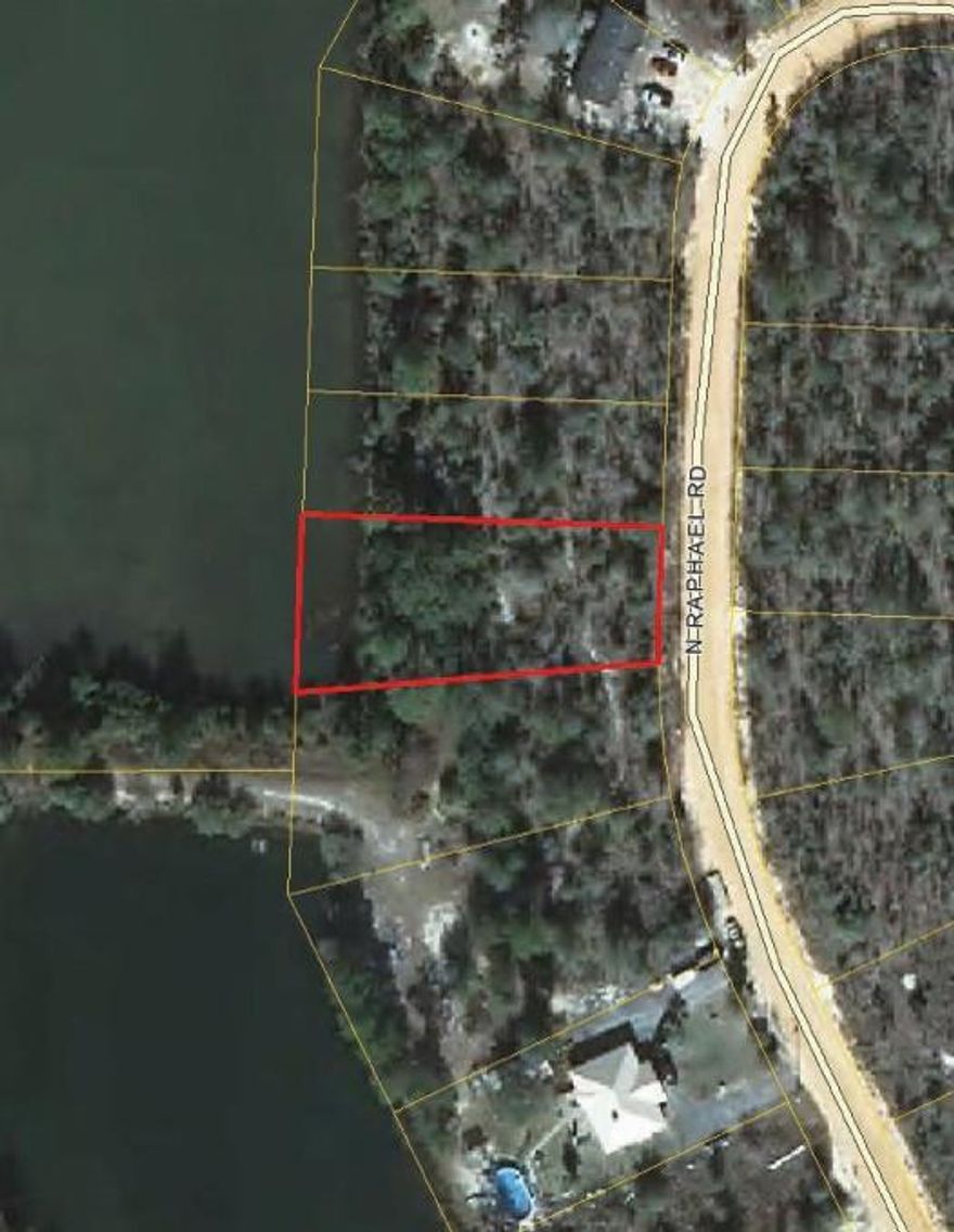 Buildable waterfront lot opposite the dam in Oakwood Lakes. The adjoining lot to the left is also available.