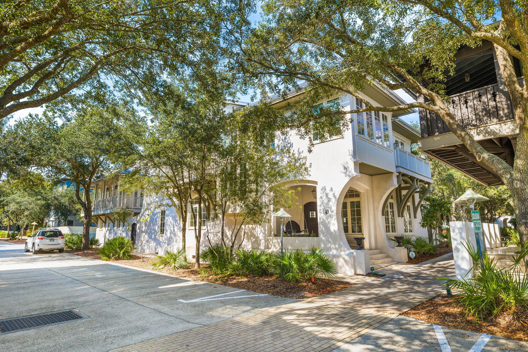 Relax and entertain in this recently redecorated home on an oversized corner lot in Rosemary Beach. 43 E Water Street is a 6 bedroom, 5 bathroom private retreat featuring a large main house and a carriage house. There are beautiful oak floors throughout with gorgeous, tumbled marble in every bathroom. The main house has a welcoming front porch with a swing that is perfect for relaxing mornings to people watch. Entering the open concept floor plan is like a breath of fresh air. The den has soaring coffered ceilings with custom molding, a beautiful, oversized limestone gas fireplace, and lots of windows for magnificent views and light.