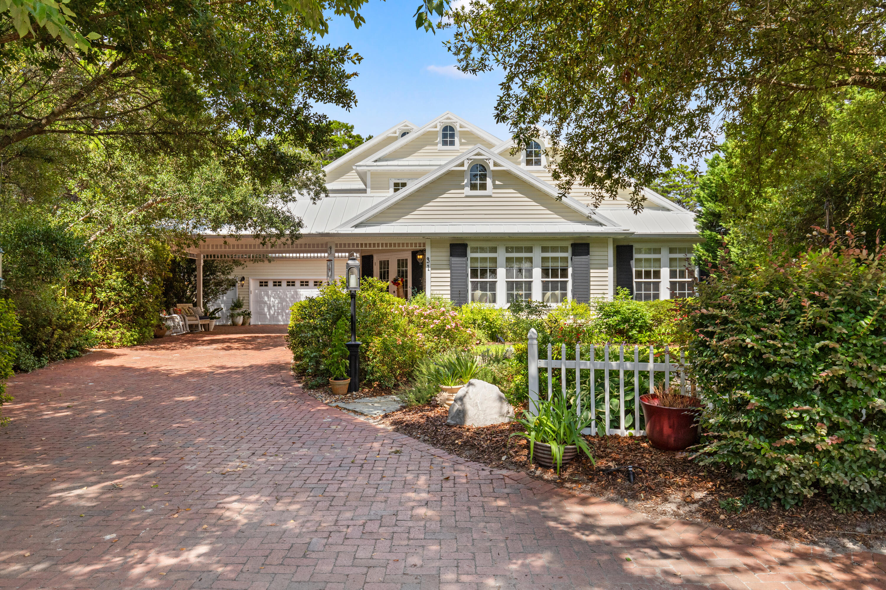 This custom built home sitting on 1/3 of an acre captures the relaxed charm of life by the beach located in the community of Seabreeze along the eastern side of Hwy 30A. Upon entering the home, you are greeted with a large foyer, sitting area and view into the living & dining rooms. The vaulted ceilings & windows provide an abundance of natural light. No detail was spared when building - custom hardwood flooring, custom cabinetry, all bedrooms w/ ensuite bathrooms., etc. The outside oasis features a fireplace, outdoor kitchen and a 2 story lanai so you can sun in comfort. The floor plan flows perfectly with creating large, open spaces while still maintaining privacy. Seabreeze has deeded beach access, access to Camp Creek Lake for kayaking & does not allow short term rentals. Just minutes from the iconic communities of Alys Beach and Rosemary Beach, you'll enjoy easy access to sugar-white sand beaches, unique boutiques, and a variety of dining options. Located in the quiet, residential Seabreeze neighborhood, where short-term rentals are not allowed, this home offers a peaceful retreat just a short walk from the Gulf.