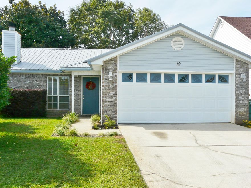 LOVELY HOME IN FANTASTIC LOCATION WITH A NEWER METAL ROOF (2011). This home has it all! The large Great Room opens to Dining and Kitchen for entertaining ease for all. The corner FIREPLACE in the Great Room is perfect for ambiance or taking the chill off. The Master bedroom is large enough for all your furniture and still has floor space to make a sitting area! There is also a WALK-IN CLOSET and the Master Bath has a DOUBLE SINK vanity and JACUZZI tub. Kitchen and baths have tile floors and living room and hall are a lovely laminate flooring. Great patio in large privacy fenced backyard with wonderful shade trees! Lawn pump & sprinkler system. The LARGER 2 CAR GARAGE completes it all. This home is close to jobs, bases, ENTERTAINMENT, BEACHES and SHOPPING!