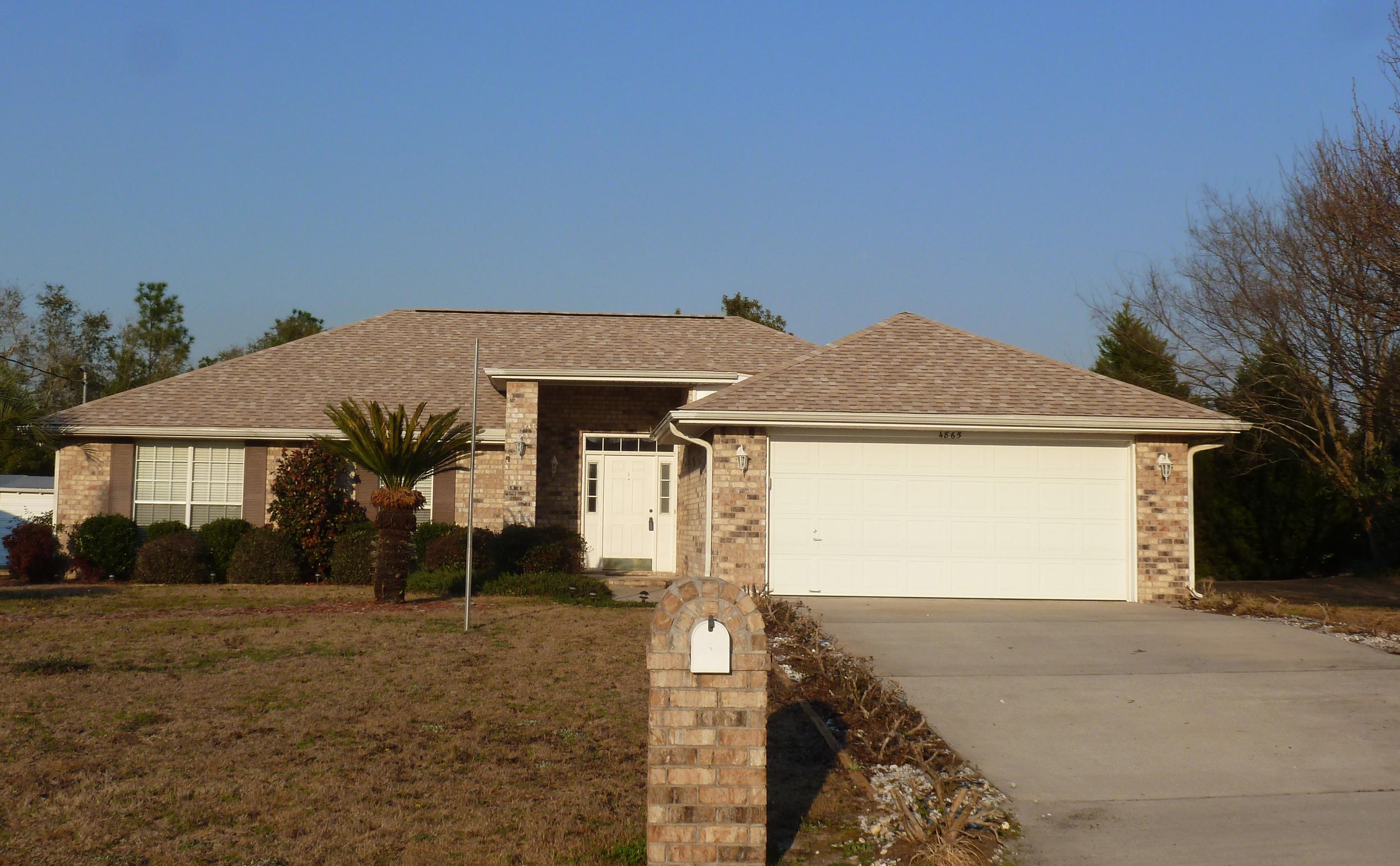 This well maintained 4 bedroom 2 bath all brick home has a NEW ROOF and is situated on a .25 acre lot on a quiet street with no thru traffic. There is a large living room with a vaulted ceiling and a wood burning fireplace. The dining area is open to the living room and overlooks the backyard. The kitchen features a breakfast bar and solid wood floors. There is a nice master suite with double vanity and ceramic tile. The remaining bath also features ceramic tile floors and is on the other side of the house with the additional bedrooms. Enjoy relaxing on your large screened-in porch overlooking your private backyard. Conveniently located on the south side of Crestview in Foxwood Estates, it is a quick drive to the 7th Group, Duke Field & Eglin. Refrigerator, washer, dryer, and yard building