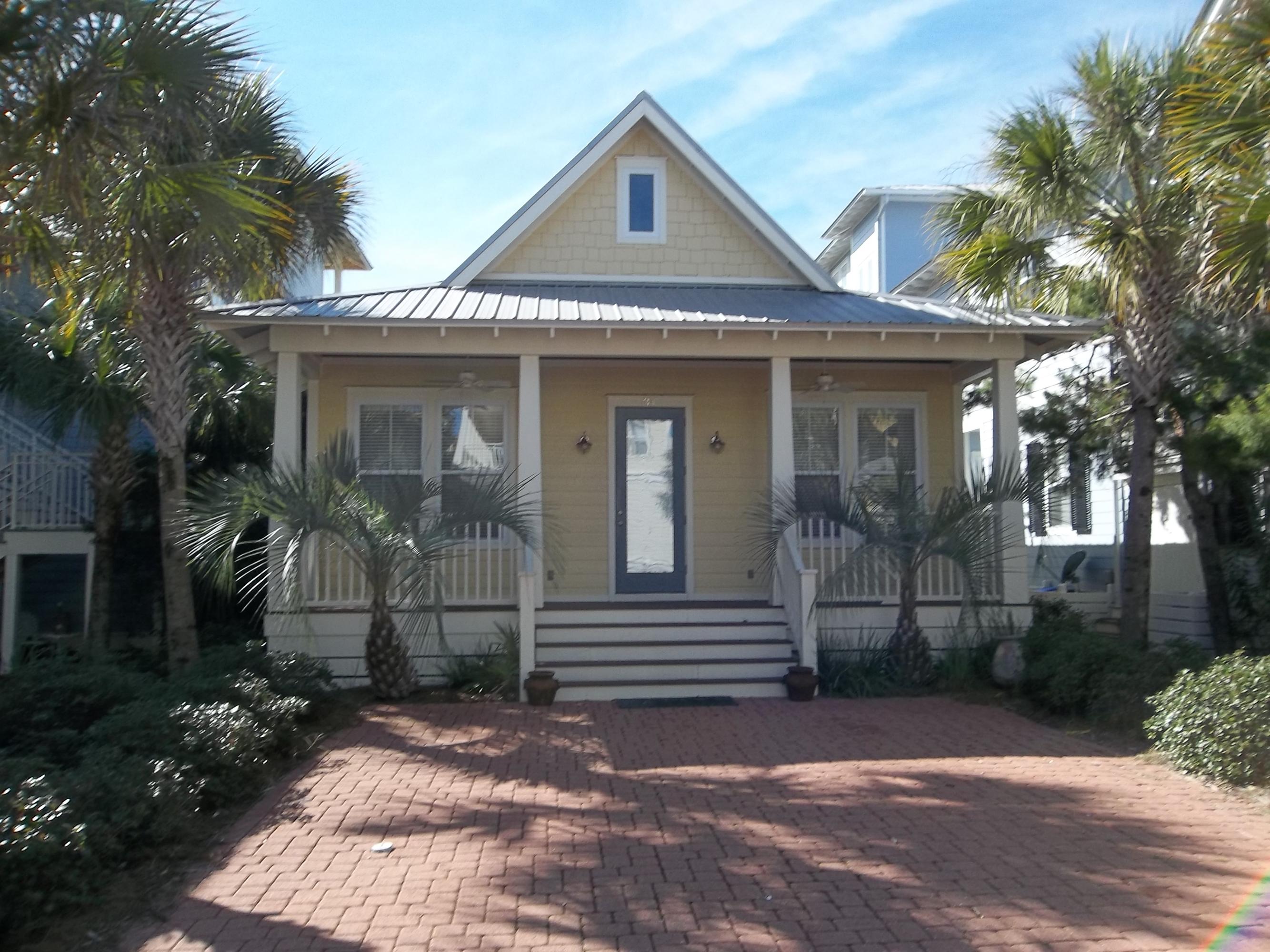 CUSTOM BUILT GORGEOUS FLORIDA BEACH COTTAGE STYLE HOME LOCATED IN SOUGHT AFTER SEACREST BEACH! METAL ROOF, HARDIBOARD SIDING, BRAZILIAN HARDWOOD FLOORS THROUGHOUT, STAINLESS APPLIANCES, GRANITE COUNTERS, FABULOUS CUSTOM SPICE BIRCH CABINETRY THROUGHOUT, 10FT CEILINGS WITH OVERSIZED CROWN MOLDING, VAULTED CEILINGS IN LIVING ROOM AND DINING AREA, LIVING ROOM HAS BUILT IN CUSTOM ENTERTAINMENT CENTER TOO. ALL NEW FLAT SCREEN TV'S. HOME CONVENIENTLY BACKS UP TO A GREEN SPACE/WALKING PATH, FRONT AND BACK PORCHES WITH CEILING FANS. HOME IS WIRED FOR SURROUND SOUND THROUGHOUT INCLUDING BOTH PORCHES. WALKING DISTANCE TO THE BEACH IS SHORT AND SWEET OR YOU CAN CALL TO BE PICKED UP BY THE COMMUNITY TROLLEY SERVICE. EXCELLENT COMMUNITY FOR VACATION RENTALS TOO!