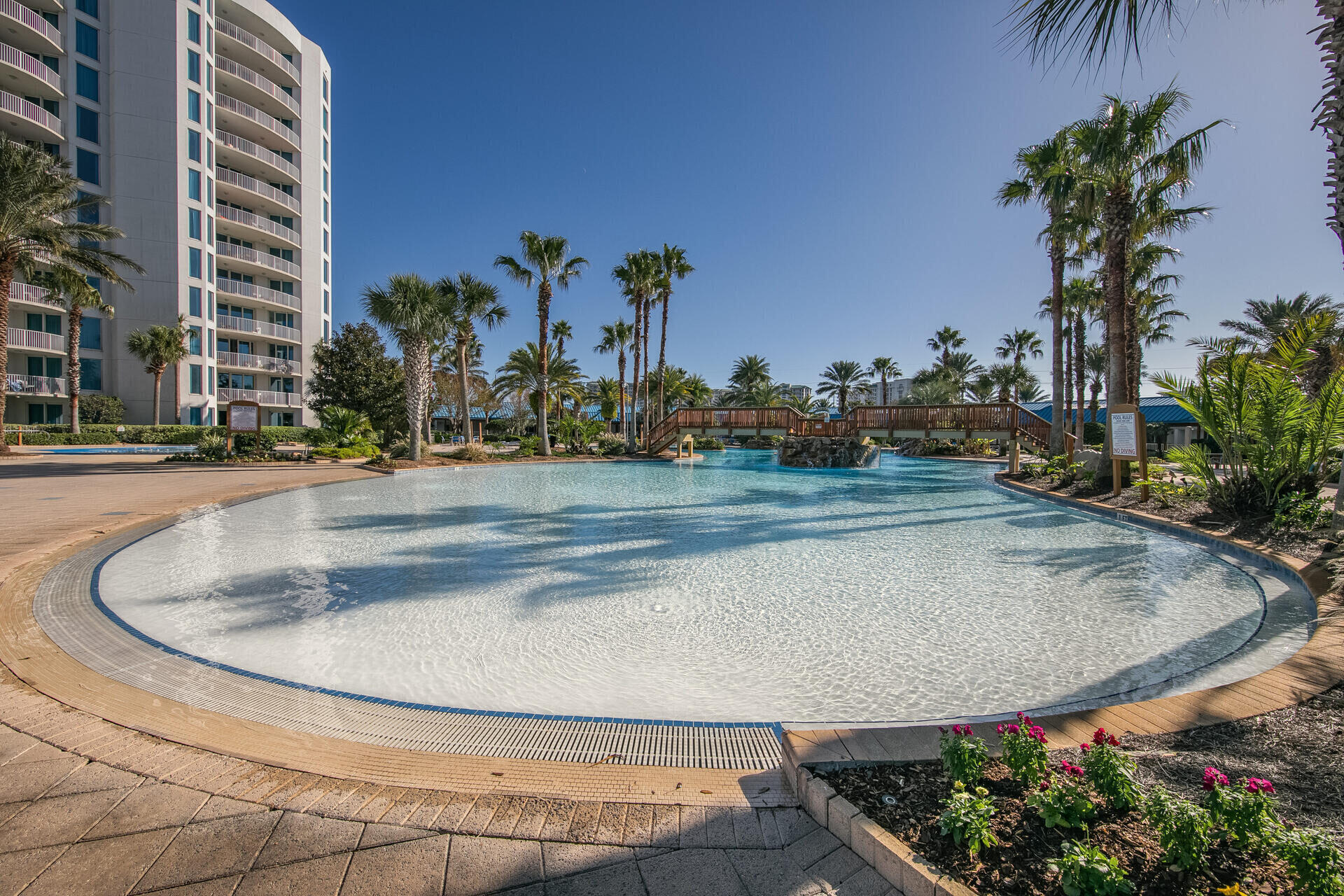 Calling all investors! PRICE DROP! Bring an offer! Highly sought after end unit open floor plan in the absolutely loaded community at The Palms of Destin. This turnkey rental machine is fully furnished and boasts 1175 square feet plus an eastern balcony. This handsome Destin Condo opens up to a spacious dining & living area joined by a granite topped kitchen. This end unit delivers Two Large Bedrooms, a rare floorplan. The sleeper sofa brings the sleeping arrangement up to 6 Adults. The Palms of Destin has endless on-site amenities including 11,000 sq ft zero entry lagoon-style pool, waterfall, hot tub, kiddie pool, splash pad, playground, gym, conference center, tennis court and basketball court. Restaurants, Bistro, and Coffee Bar are just a few of the leisure amenities on site. The Palms offers breakfast, lunch, and dinner. The resort offers complimentary shuttle service from the lobby to the beach. This community is minutes away from Destin's Fun Track, Urban Air, Dick's Sporting Goods, Destin Commons, Harborwalk Village, Baytown, and more.