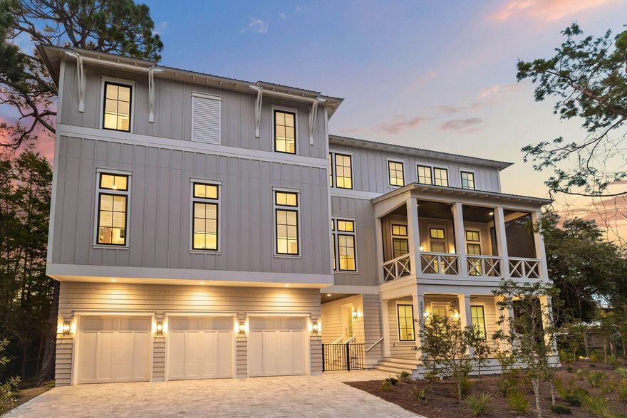 Completed in 2023, this stunning three-story beach house is close to everything on coveted 30A. Occupying a generous 0.4-acre lot, it sits back from the road behind established landscaping. A wide paved driveway and a three-car garage provide ample parking to the front, with an open breezeway giving access to the large private terrace and saltwater pool to the rear. A spillover spa offers a tinkling harmony for the extensive terrace, incorporating a BBQ area and a cozy fire pit for cooler evenings. The entire rear yard is securely fenced and surrounded by established trees, ensuring privacy. The thoughtful architectural design of this brand-new home combines a host of practical features, including EV charging points in the garage, tankless water heaters and two A/C units.